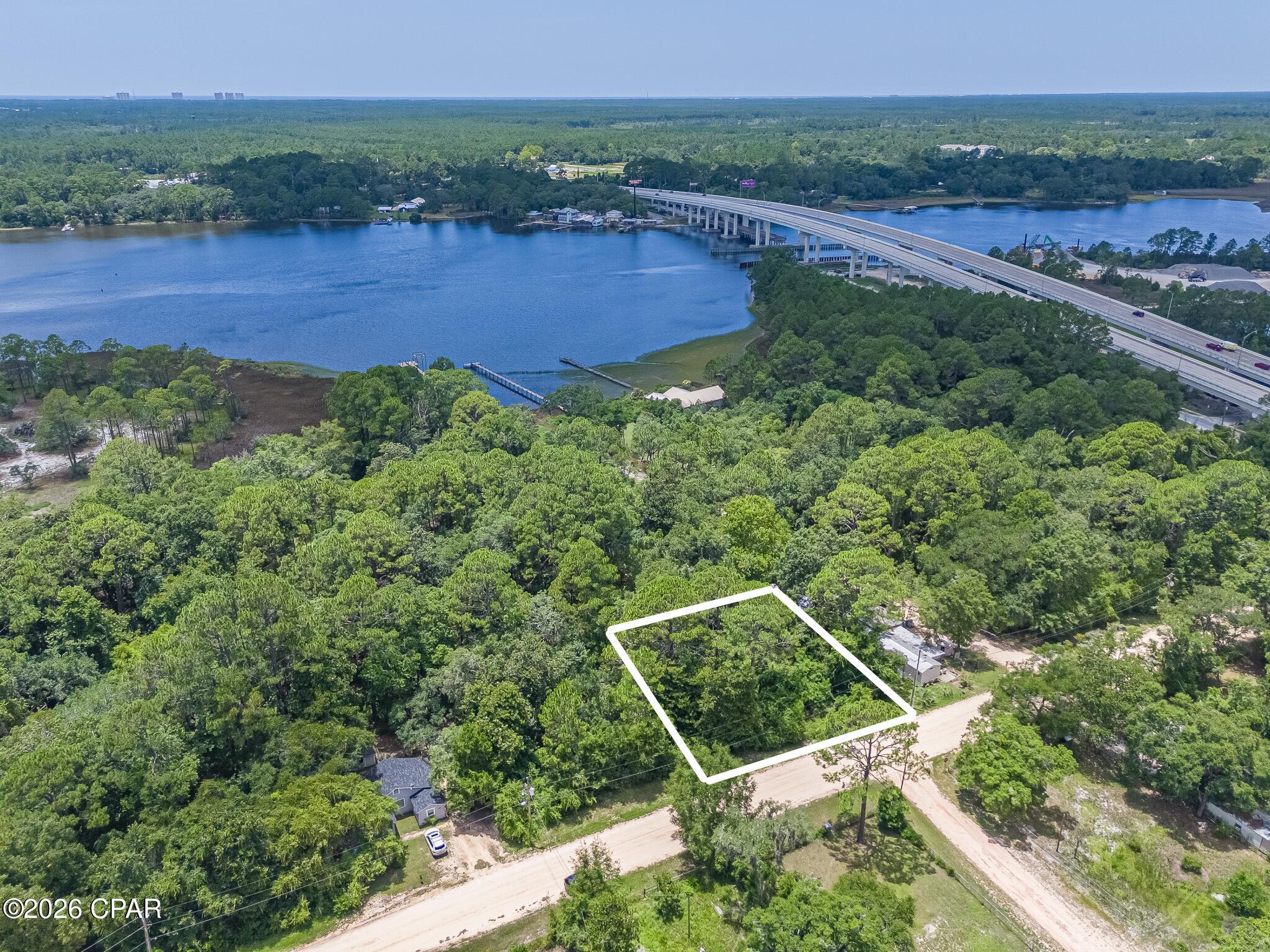 Discover the possibilities with this vacant homesite located just north of the West Bay Bridge in Panama City Beach. Ideally situated on the north side of the Intracoastal Waterway, this property offers a great location for those who enjoy boating, fishing, and the coastal lifestyle.
A public boat ramp is conveniently located on the south side of the West Bay Bridge, providing easy access to the Intracoastal Waterway, St. Andrews Bay, Shell Island, and the Gulf for a day of fishing or boating. Enjoy the convenience of being close to Pier Park, the Gulf beaches, Northwest Florida Beaches International Airport (ECP), and the area's continued growth and development.
Looking for additional space? The adjacent lot is also available for purchase, creating an excellent opportunity to own two side-by-side parcels for a larger homesite or future investment.
Buyer to verify all pertinent information, including lot dimensions, zoning, land use, utilities, environmental conditions, development potential, and any building requirements. All measurements are approximate and should be independently verified.