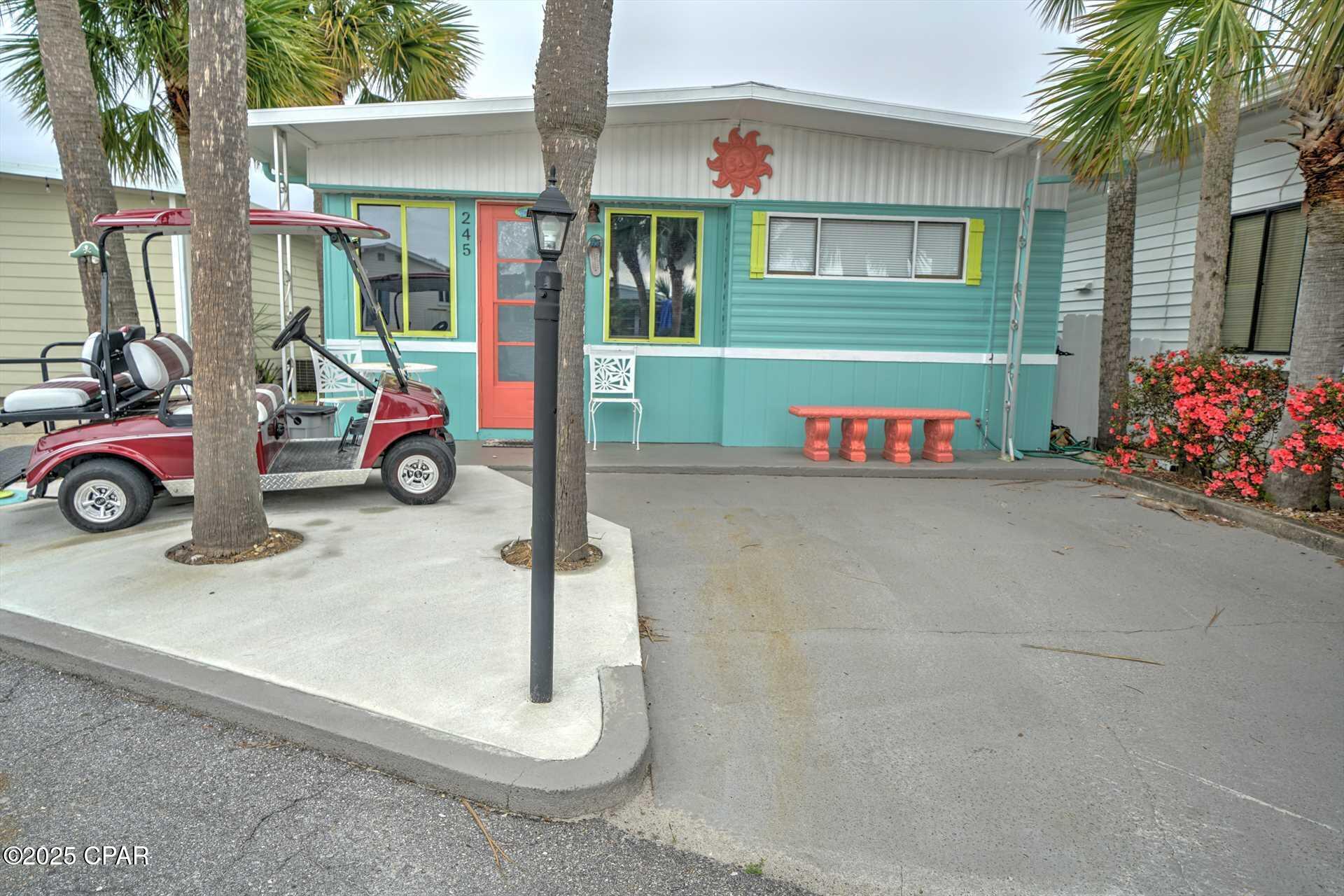 Here's your chance to own in Venture Out! Check out this adorable 2-bedroom charmer. Great living room and large kitchen. This home will come fully furnished with golf cart. You will love the convenient shed that comes complete with washer/dryer. Perfect opportunity for investment or second home.  Venture Out is a golf cart community that has exploded with popularity recently... With 300' on the beautiful pristine beaches of the Gulf of Mexico and 1,000' on the Grand Lagoon. Venture Out has something for everyone.