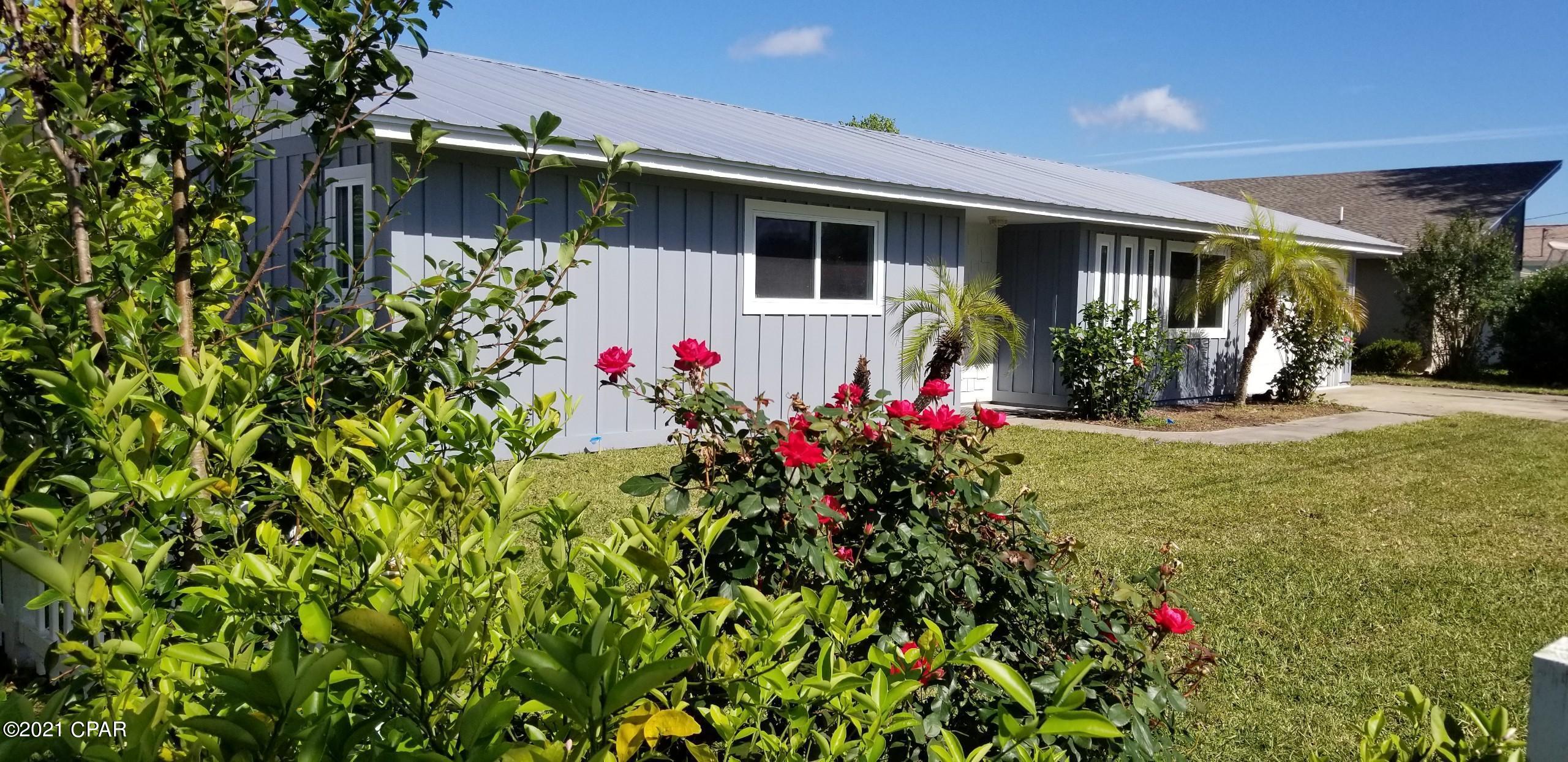 CURRENTLY UNDER CONTRACT, SELLER ACCEPTING BACKUP OFFERS. Situated on E. Gulf Blvd less than 1800 feet from the clear emerald waters of the Gulf of Mexico at Panama City Beach Access #51 you're sure to enjoy sunny beach days and sensational sunsets all while being near the area's premier recreational, dining, and shopping venues. This charming 3 bedroom 2 bath home offering approximately 1,543 sq ft plus garage offers its new owner many recent improvements including fresh paint, a new metal roof, and 50 year cementious siding. The Florida Room leads into the large back yard that's perfect for entertaining family and friends. Everything about this home comes together to create the perfect space that's ideal for a private beach retreat and/or your next investment in the perfect location. Plenty of backyard space for a swimming pool amenity or other water feature. Please verify all measurements if important.