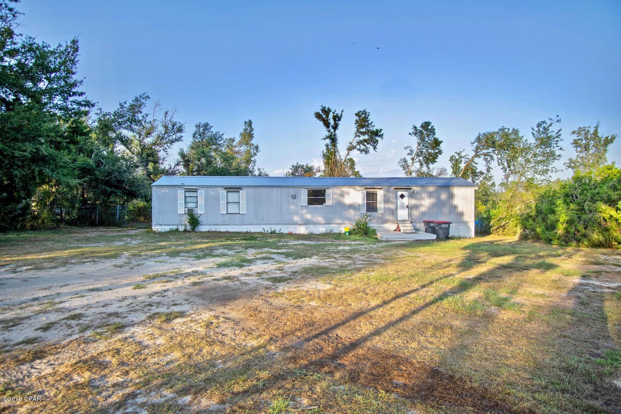 Country life and affordable living on over 1/2 of an acre! This one of a kind property is a must see.  Partial views of Deer Point Lake! Conveniently located to great schools and entertainment.  Whether you like boating, fishing, or just relaxing, this is the perfect property for you. The home boasts over 1,300 sqft of heated and cooled space along with 3 bedrooms and 2 bathrooms. This home is a must see! Call for more information or to schedule a showing today!