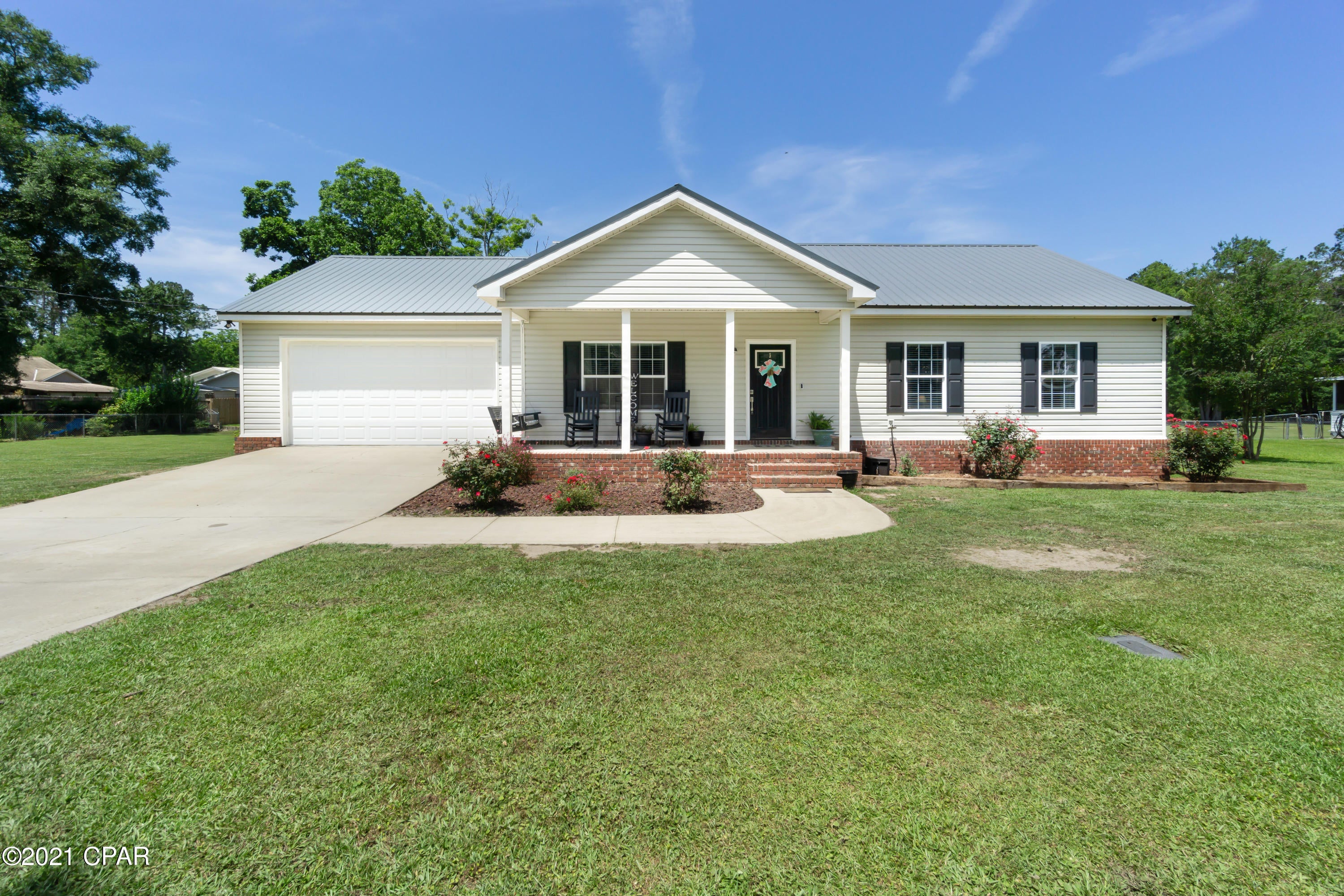 This charming 3-bedroom, 2 bath home is full of character and a must see! Inside you will find a large family room, eat-in kitchen with breakfast bar, an abundance of cabinetry, pantry and stainless-steel appliances. The spacious master suite boasts a walk-in closet, double vanity, tub/shower combo and a second shower. Outside features include front and back porches, luscious landscaping, attached garage and new metal roof. Home is situated on a large city lot, a short drive to schools, shopping and restaurants.
