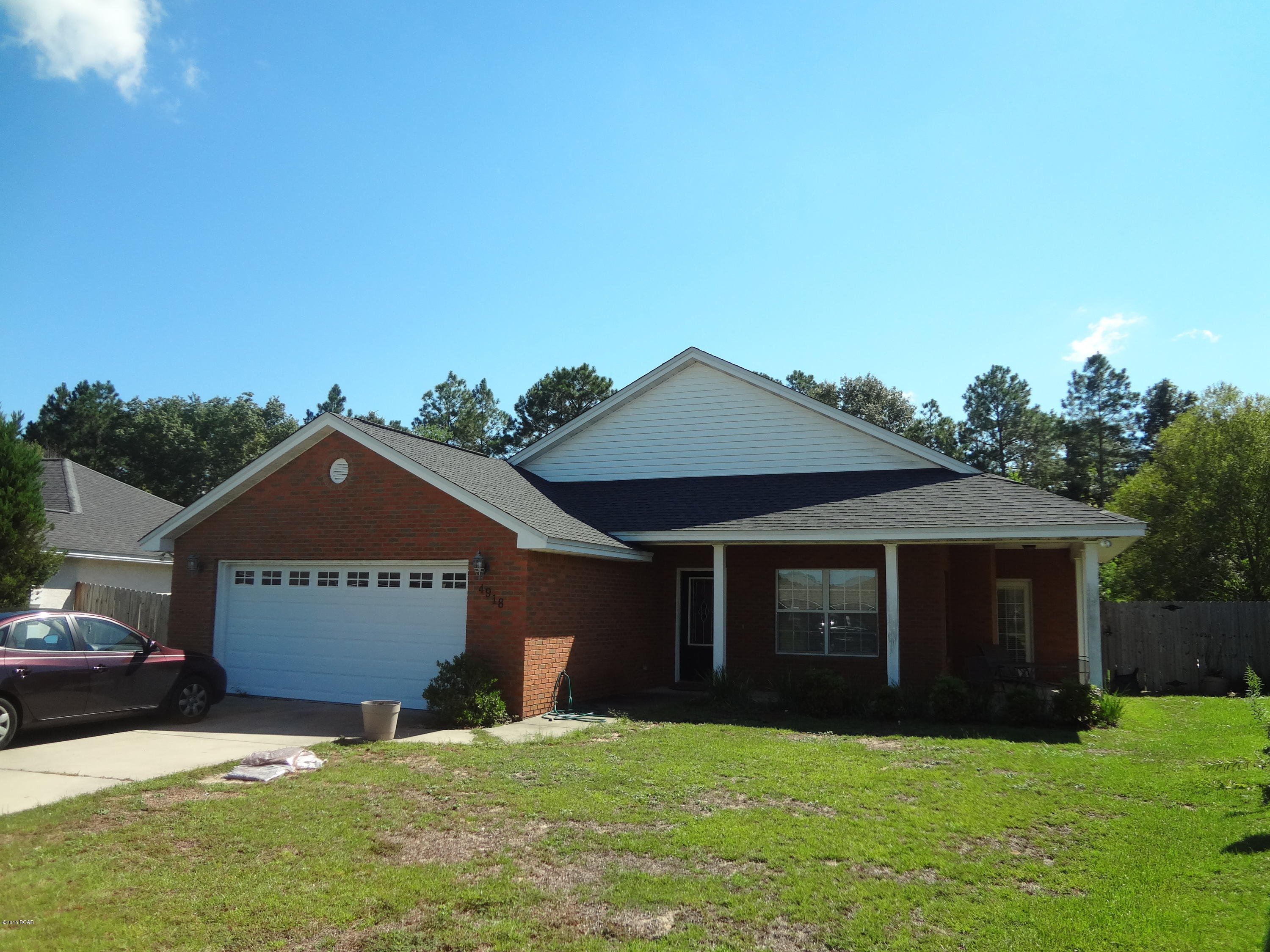 Quality all brick home with three bedrooms and two baths. Large privacy fenced back yard. Beautiful kitchen with custom cabinetry and contemporary counter tops. A generous stainless steel appliance package and a pass through opening to living room. Enjoy the bright and sunny dining area that opens onto the covered patios in front and back of home. Living room features a fireplace and tile floors are throughout the living areas. Large master bedroom and massive master bath with corner tub and separate shower. Large laundry room and home comes with washer and dryer. Call to view today!