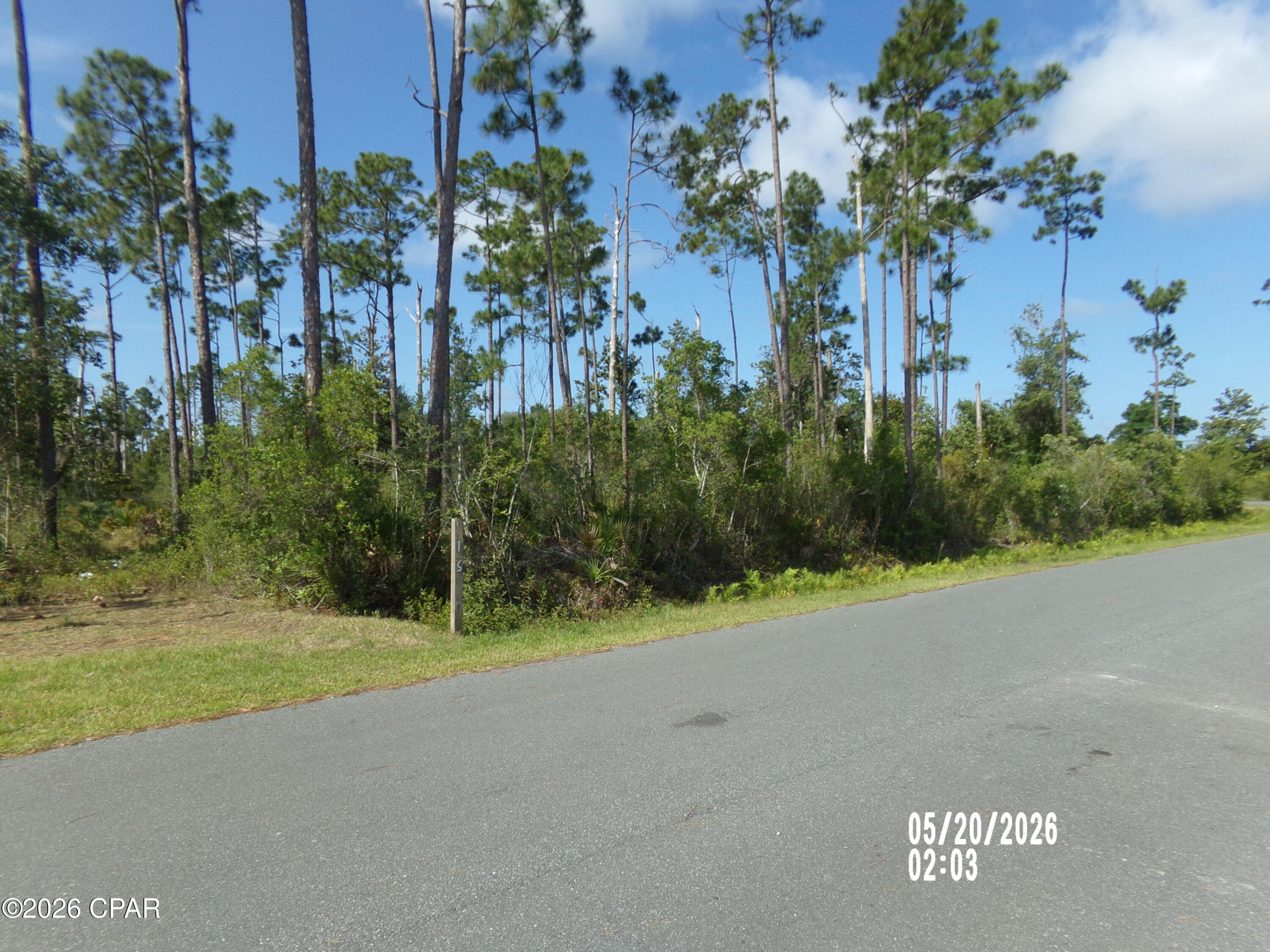 Build your dream home on this beautiful 2-acre vacant parcel offering the perfect balance of peaceful 'country living' and convenient access to town. Located on a quiet street with lovely, well-maintained properties, this uncleared land provides plenty of space for horses, chickens, and other livestock while still being close to everyday amenities.

Outdoor enthusiasts will love being just 5 minutes from Cook Bayou Marina, featuring a public boat ramp, bait store, and local waterfront pub. Cook Bayou provides access to East Bay and onward to the Gulf of America, making this an excellent location for boating, fishing, and enjoying life on the water.

Enjoy the privacy and freedom of country living while remaining only 20 minutes from Tyndall Air Force Base and 15 minutes from the City of Callaway, where you'll find shopping, dining, schools, grocery stores, and more.

A well, septic system, and power pole will be needed, allowing you to design and develop the property to suit your vision.

Whether you're ready to build now or invest for the future, this property offers space, location, and endless potential. All measurements, zoning and sizes are approximate, please verify if important.