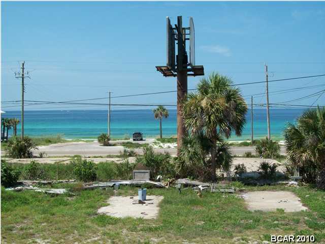 **SELLER WILL CONSIDER ALL OFFERS!** Great view of the Gulf of Mexico!! Large approx 200x100 lot on a bluff. Perfect for large home or development. Zoning for this parcel is C2. You're less than a block from a dedicated beach. Many options for this property and the location is perfect with Pier Park and Frank Brown Park just 5 minutes away. All info is approx and must be verified by Buyers if important. Building on property has no value. Per the PC Beach Water Department, there are sewer lines approx 320' from the propert