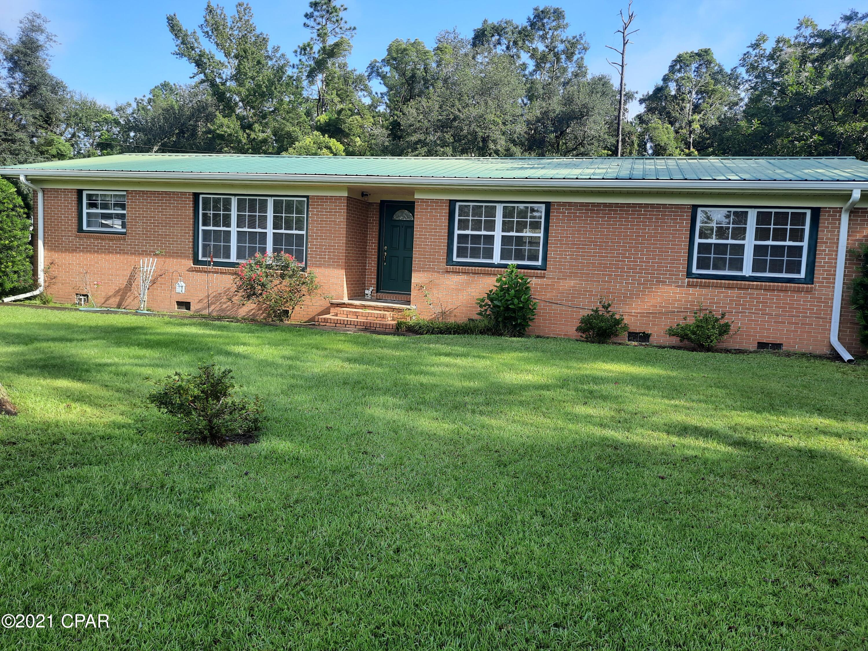 This 4 Bedrooms 2 Baths Brick Home is located South of Bristol in Liberty County. You feel like you are in the country, with no noisy neighbors around.   Woods on all 3 sides. Only two miles from town.  Perfect home for large family with lots of room to play outside. Newly painted Living Room and Hallway. New Vinyl Plank Floors. Electric Water Heater only 4 years old.  Metal Roof. Central Heat and Air replaced 2013. 24X30 Pole Barn. Several fruit trees: pear, blueberry, and satsuma.  This is a move in ready home at closing. Only an hour to Beautiful Panama City Beach or Tallahassee.