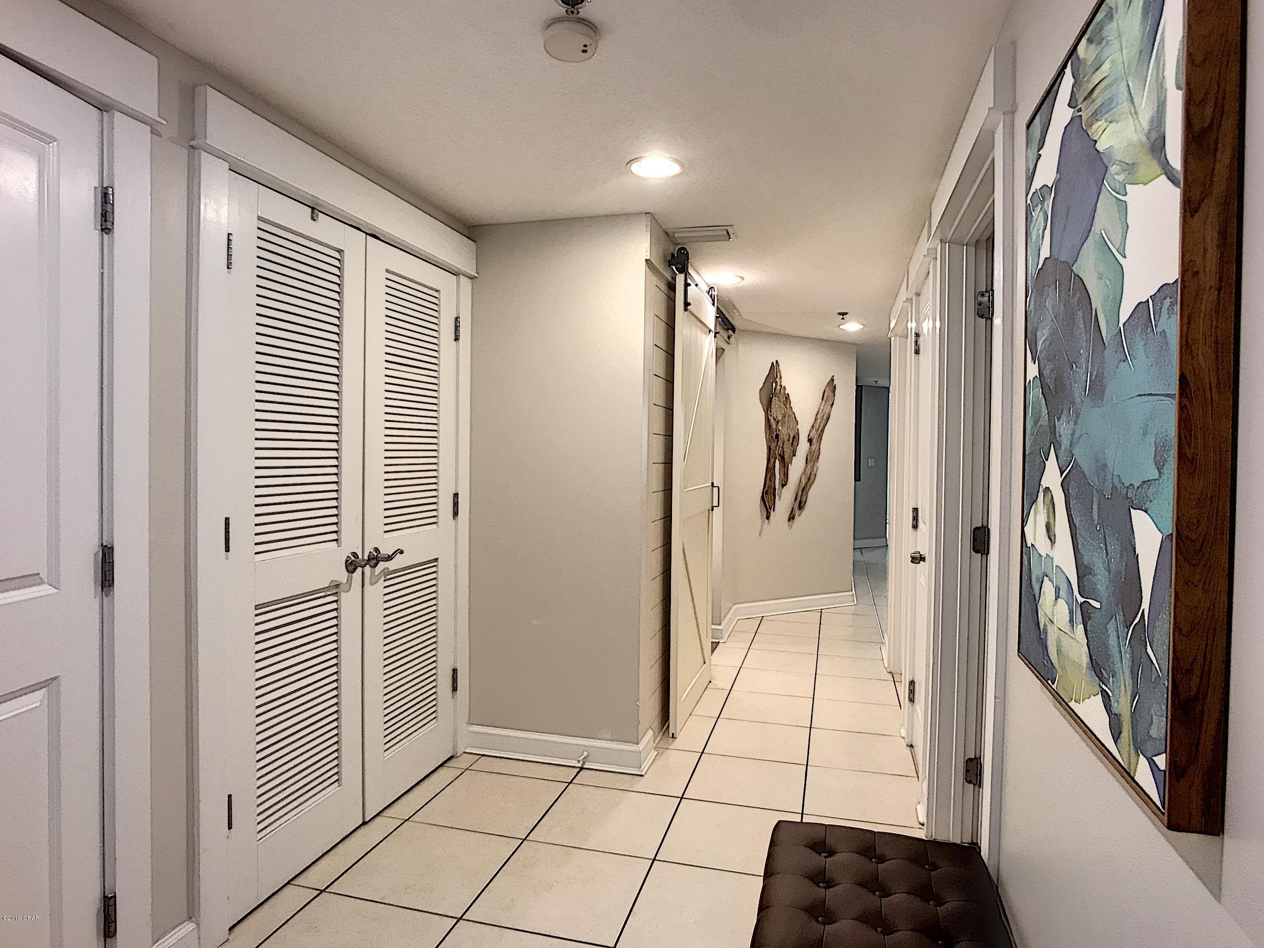 Highly sought after lower floor 2BR/2BA + bunk cove with barn doors at the popular Grand Panama Beach Resort. This immaculate condo is turn key rental ready with solid surfacing flooring throughout. Condo was professionally decorated by an interior designer. Furniture and furnishings are less that one year old and included in the price. Stainless appliances, gulf front master bedroom, and spacious balcony. Yes, this one's a little more expensive. But when you see it, you'll know where that extra money went. Nothing wrong with the others, but this one is what you deserve and guests will want to reserve for their vacation.