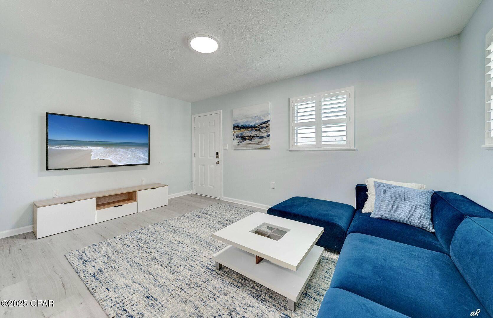 Live just ¼ mile from the beach in this inviting 1-bedroom, 1-bath home in Panama City Beach's desirable Lower Grand Lagoon area. Available furnished or unfurnished, this comfortable coastal rental gives you the flexibility to make it your own or move in with the essentials already in place.

The bright interior features LVP flooring, soft coastal colors, plantation-style shutters, and a comfortable living area with a wall-mounted television. The kitchen offers white cabinetry, stainless-steel appliances, a tile backsplash, and an adjoining dining area.

Enjoy being a short walk from the beach and close to local restaurants, shopping, entertainment, and three nearby boat ramps offering access to the Gulf of Mexico. Whether you enjoy boating, fishing, beach days, or simply relaxing near the coast, this convenient location places you close to it all.

Homes this close to the beach are hard to find. Contact us today to schedule your showing!

Fraud Alert: Neither our company nor the property owner advertises rentals on social media. We will never request payment through Zelle, Venmo, Cash App, wire transfer, or gift cards. Applications and payments are accepted only through our official website and secure resident portal.