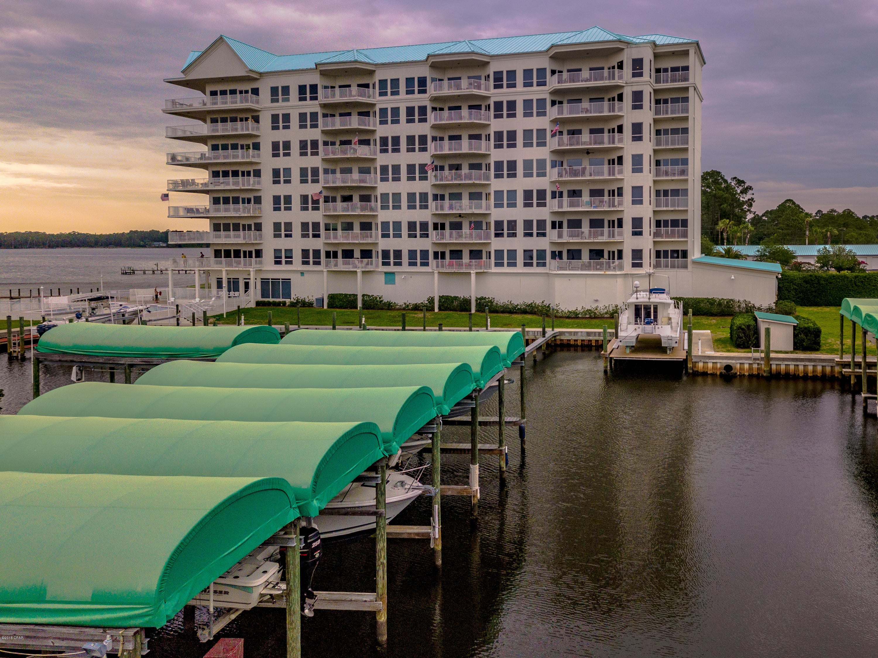 MOTIVATED SELLER!!!  Huge Price Reduction on this beautiful 3 Bedroom Bay front Condo, untouched by Hurricane Michael.  This spacious floor plan is flooded with natural light and includes beautiful hardwood floors, solid surface counter tops and tray ceilings.  Enjoy the gorgeous sunsets and Bay views from almost every space in this home.  You will love the comfort and convenience of a condominium lifestyle without having to navigate beach traffic,  Come and see for yourself all that this lovely home has to offer.