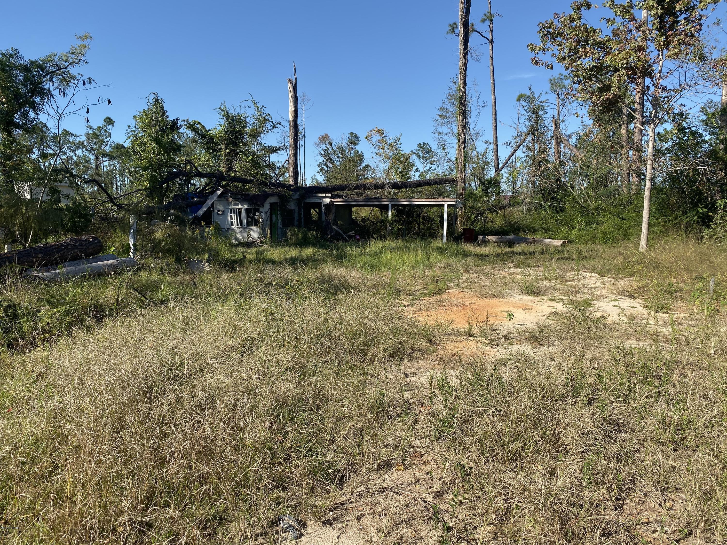 .7 acres with a well and septic on a paved road. This property would make a great homesite as it is only a tenth of a mile off of Highway 231. There was a mobile home on the property when the sellers purchased it, but they had it removed. There is some sort of structure on the property. Could be used as a shed. A lot of cleanup has been done to the property since Hurricane Michael, but there is more to be done. Sellers do not know the condition of the well and septic nor have they ever used them. This should be verified by a buyer.