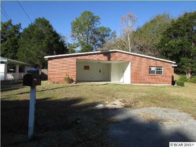 *EQUAL HOUSING OPPORTUNITY* Unique brick home located in Lynn Haven community offers charm inside and outside. Incredibly large backyard is fenced and is pefect for expanding the home, adding a pool, garden or workshop! Floor plan includes a formal living room and dining room excellent for guests, a family room for added space and a kitchen that is light & bright. Country cabinets, tile flooring, crown molding and a breakfast area. Master bedroom contains large closet space and storage. Additional bedrooms are also generously sized. Ceiling fans are found throughout home! So much potential to create the home of your desire. Easy access to downtown Lynn Haven, Deer Point Lake and Lynn Haven Golf Course. This location has it all.