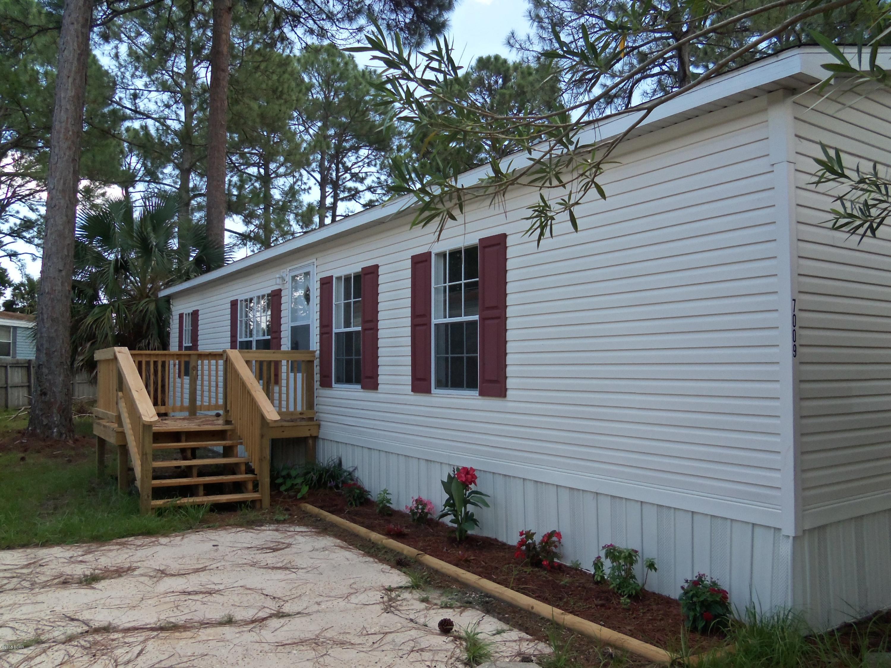 Completely renovated! Don't wait to buy your home at the beach! This 3 bedroom, 2 bath home has had a complete face lift! New paint, new flooring, new bathroom fixtures & lighting! Open floor plan, large great room, kitchen has lots of cabinets and a breakfast area. Even has a 2 car carport! Looks great - move in condition. Large lot with fresh landscaping, no HOA fees, close to the water - Bayside Marina is at the end of this road and has a boat ramp! Close to the bridge - easy commute to town. Must see! (all sizes approximate and taken from public records, buyer to verify any details buyer deems important)