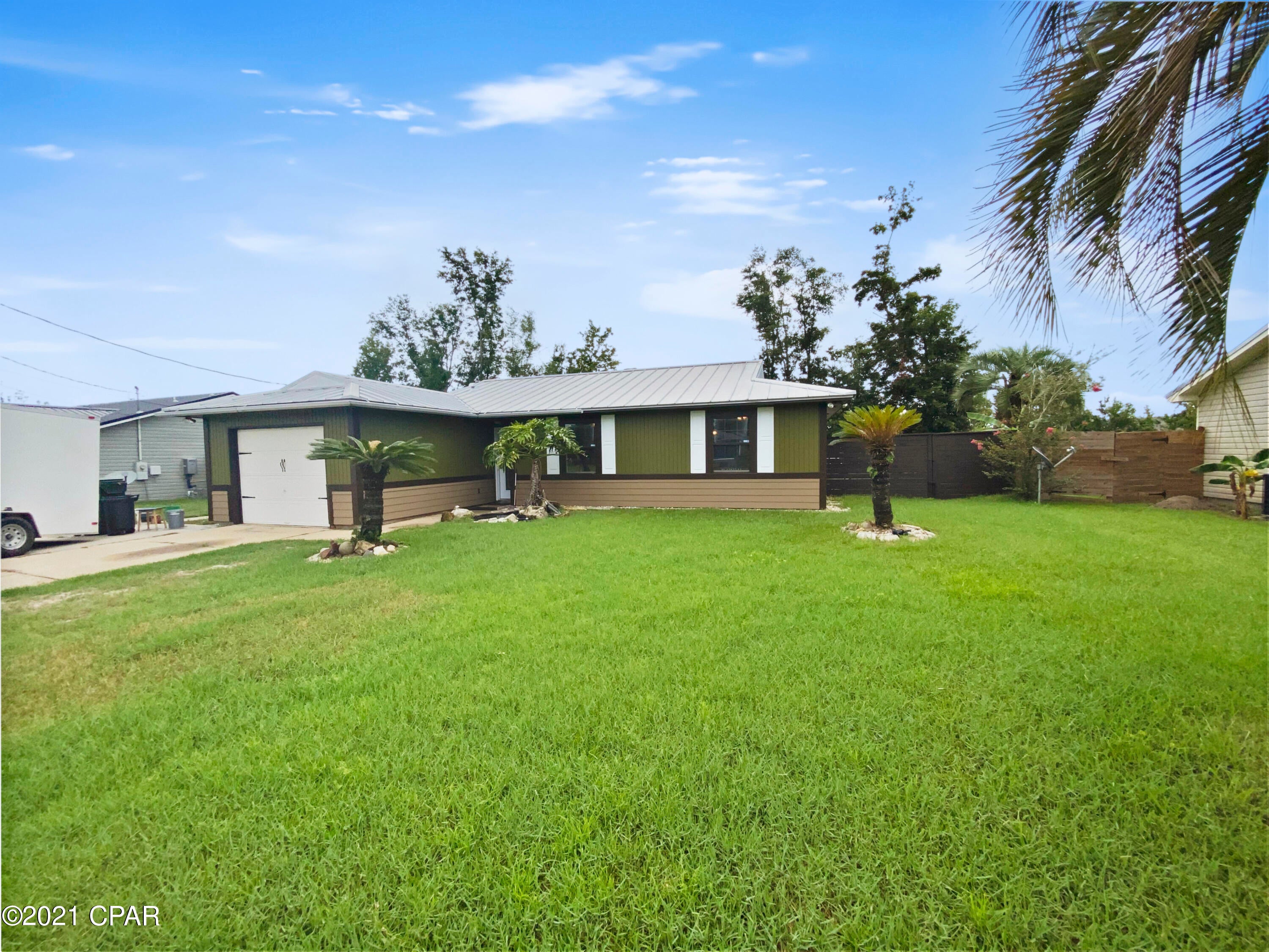 ''UNDER CONTRACT SELLER TAKING BACK UP OFFERS  Beautifully renovated home in the conveniently located Lynn Haven neighborhood of Pine Forest is waiting for you! This 3 bedroom, 2 bath has just enough space and offers freshly painted interiors, and brand-new carpet in bedrooms. You will love the bright, open concept kitchen and living areas offering plenty of natural light, white cabinetry and gorgeous vinyl plank flooring to complement any style. A fully enclosed garage offers a potential extra room, and the metal roof makes for peace of mind. Enjoy great outdoor living opportunities with your own pool, a nice sized backyard with brand new fence, oversized driveway allowing for that boat, and the best part....no HOA fees! Pool liner to be replaced. Measurements are approximate
