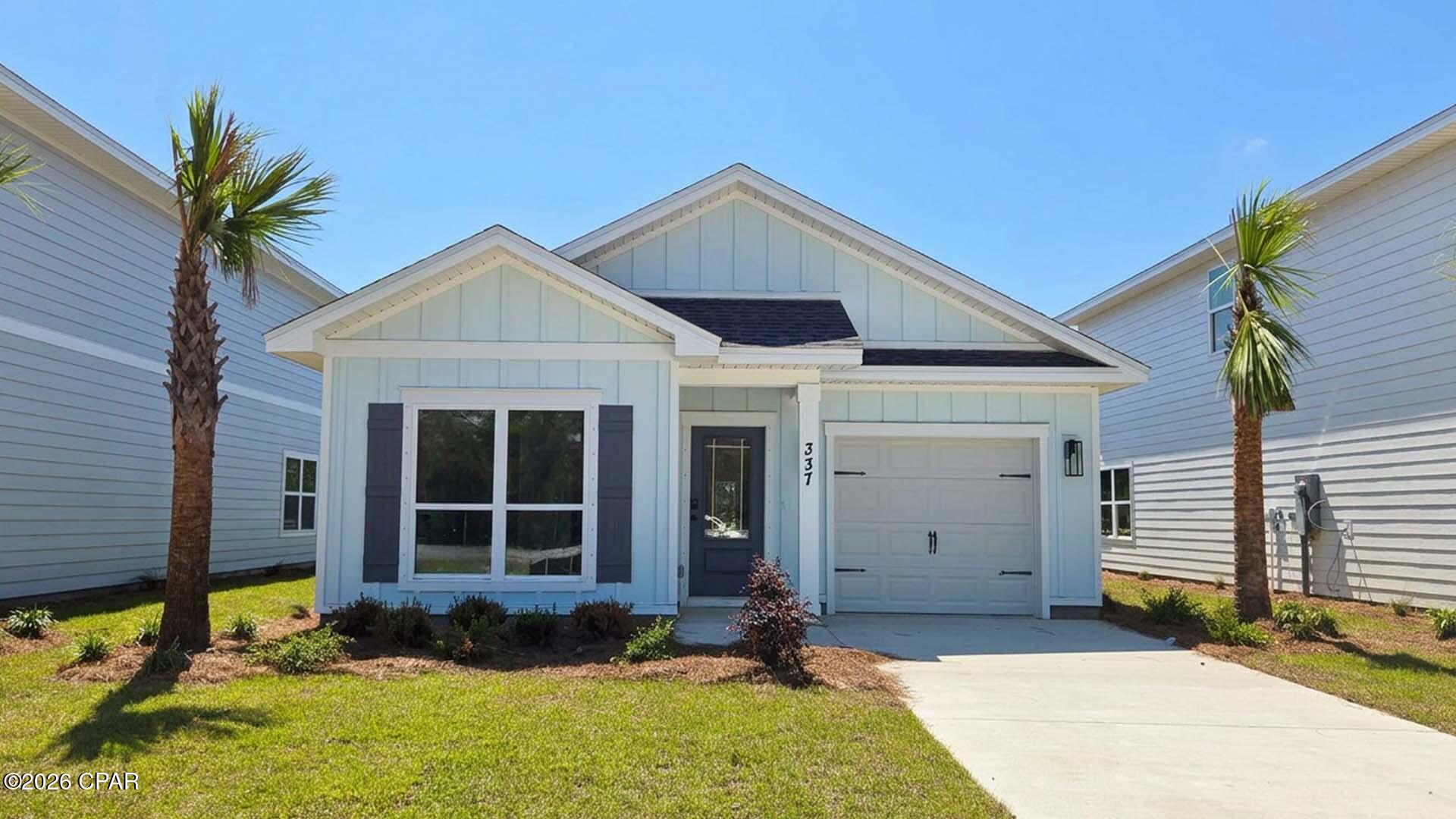 Welcome to 337 Robinson Bluff Road, a new construction move in ready home at Colonial East in Panama City Beach, Florida. 
Entering the home through the covered entry, you will find a hall with two delightful guest bedrooms, each offering a peaceful retreat for your family or guests. The guest bedrooms share a full bath with a single vanity and shower tub combination. Continuing through the hall, you will enter the heart of the home where an open-concept layout unites the kitchen, dining and living areas. This is an ideal space for entertainment and relaxation and offers guests and family a comfortable living space. The Delilah floorplan is designed as a cottage style home, with a comfortable layout and a single car garage. The well-equipped kitchen features modern cabinetry, a generous center island for meal preparation, and effortless interaction with family and guests. Adjacent to the kitchen, there is a small pantry and a laundry room that can accommodate a full-size washer and dryer. The living area provides access to the back patio, where you can dine al fresca or just enjoy your mornings outdoors. Features of this home will include quartz countertops, EVP flooring throughout, matte black plumbing fixtures and appliance package that will include a stove, microwave and dishwasher.

The primary bedroom is situated at the back of the home and has a sizable walk-in closet and an ensuite bathroom with a single sleek vanity and a rejuvenating shower. Images are of a Delilah model home and may include custom design features not available in other homes. Furnishings and decorative items are not included with home purchase.