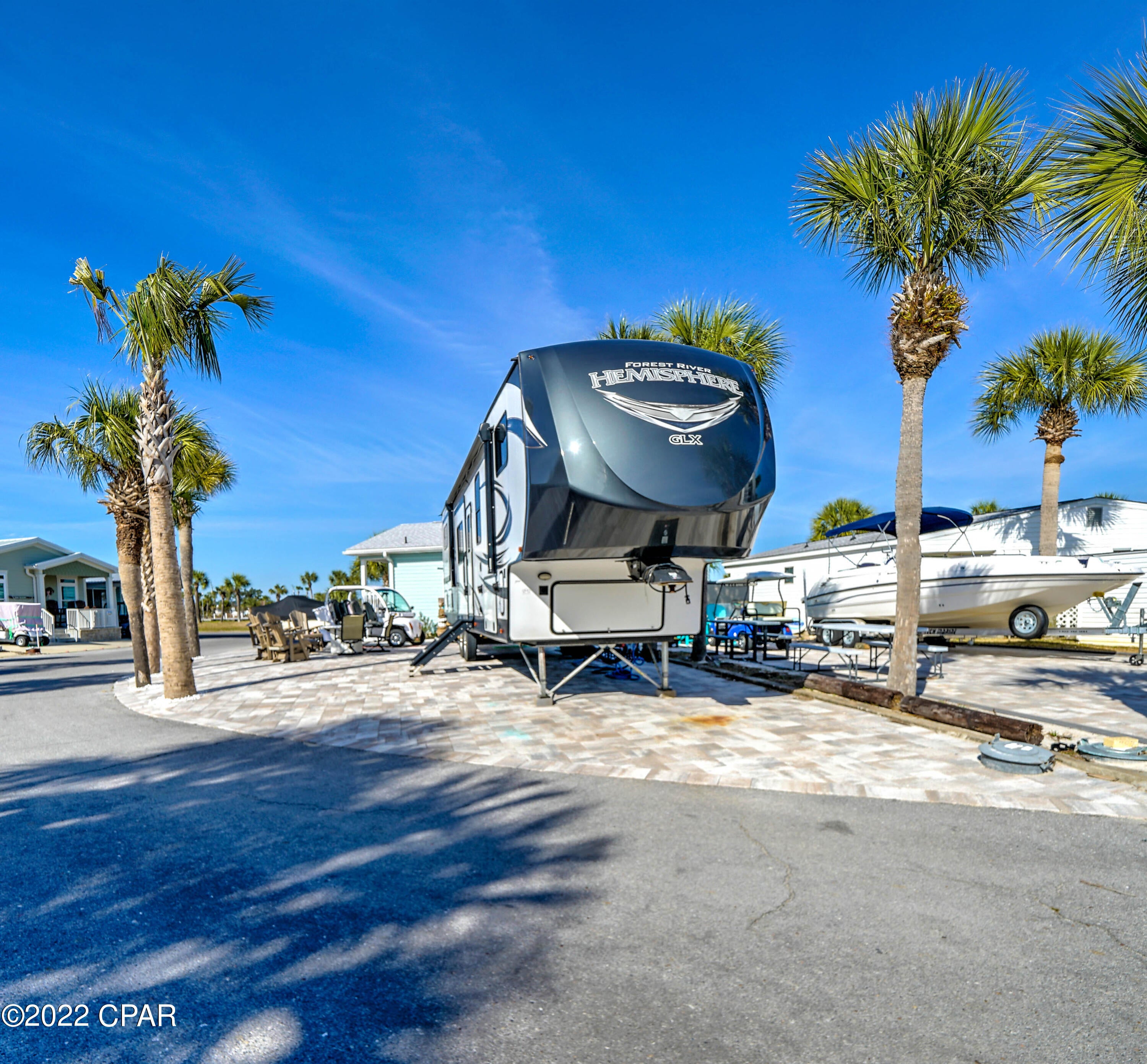 Great opportunity to own in beautiful Venture Out. This stunning corner lot is perfect for building your dream home or bring your RV! The location is amazing within the resort... close proximity to pool, boat launch, fishing pier and more! Venture Out is a golf cart community that has exploded with popularity recently... With 300' on the beautiful pristine beaches of the Gulf of Mexico and 1,000' on the Grand Lagoon. Venture Out has something for everyone. With 2 pools, fishing pier, boat ramp, mini golf, children's playground and much more!