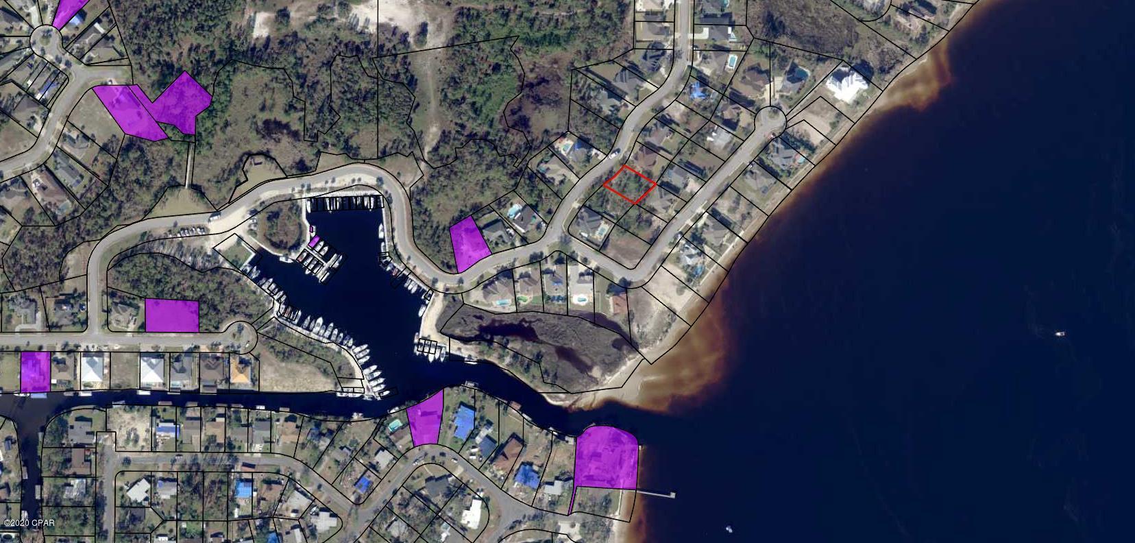 Here is the opportunity to build a home in this beautiful community! This lot is located in the prestigious Gated, Bay Front and Marina community of Dolphin Bay. The planned community has a deep-water marina with slips for rent or sale and a boat ramp for easy access to North Bay, the Inter-coastal waterway and the Gulf. Fenced/lighted tennis courts are provided for the sports minded. Dolphin Bay is centrally located between the ''Beach'' and Panama City/Lynn Haven, with convenient access to the Navy base, beaches, schools, restaurants, shopping and entertainment venues. PRICED TO SELL LOT! All lot dimensions are approximate and should be confirmed by the prospective buyer prior