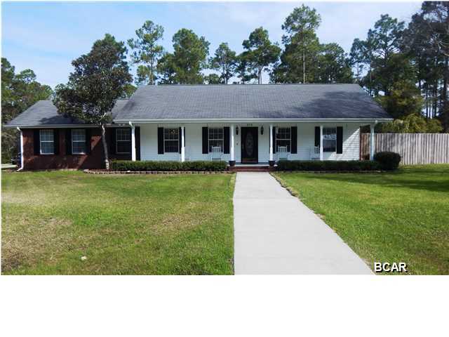 If you love to entertain or have a large family then this beautiful custom home is just for you. Located in a quiet neighborhood minutes from Tyndall Air Force Base and shopping. You will feel right at home from the minute you pull into the driveway. Inviting front porch for you to enjoy your morning coffee and newspaper. Open floor plan with lots of windows to let the sun shine in. Home features maple cabinets with bookcases on each side of Appalachian Wood Stove to enjoy those cold nights. Vaulted ceiling, large living area that is wired for surround sound and office. Spacious kitchen with breakfast bar, custom oak cabinets, new granite counters and pantry. Master bath has a Jacuzzi tub that is amazing, separate tiled shower and double vanity. Step outside into your screened porch