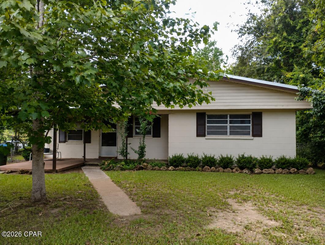 Built in 1954, this 3-bedroom, 1-bath concrete block home features a roof replaced in 2015 and an HVAC system approximately 4 years old. Flooring includes carpet and wood. Additional features include chain-link fencing along the side of the home and a dirt driveway. Great opportunity for renovation and improvement!