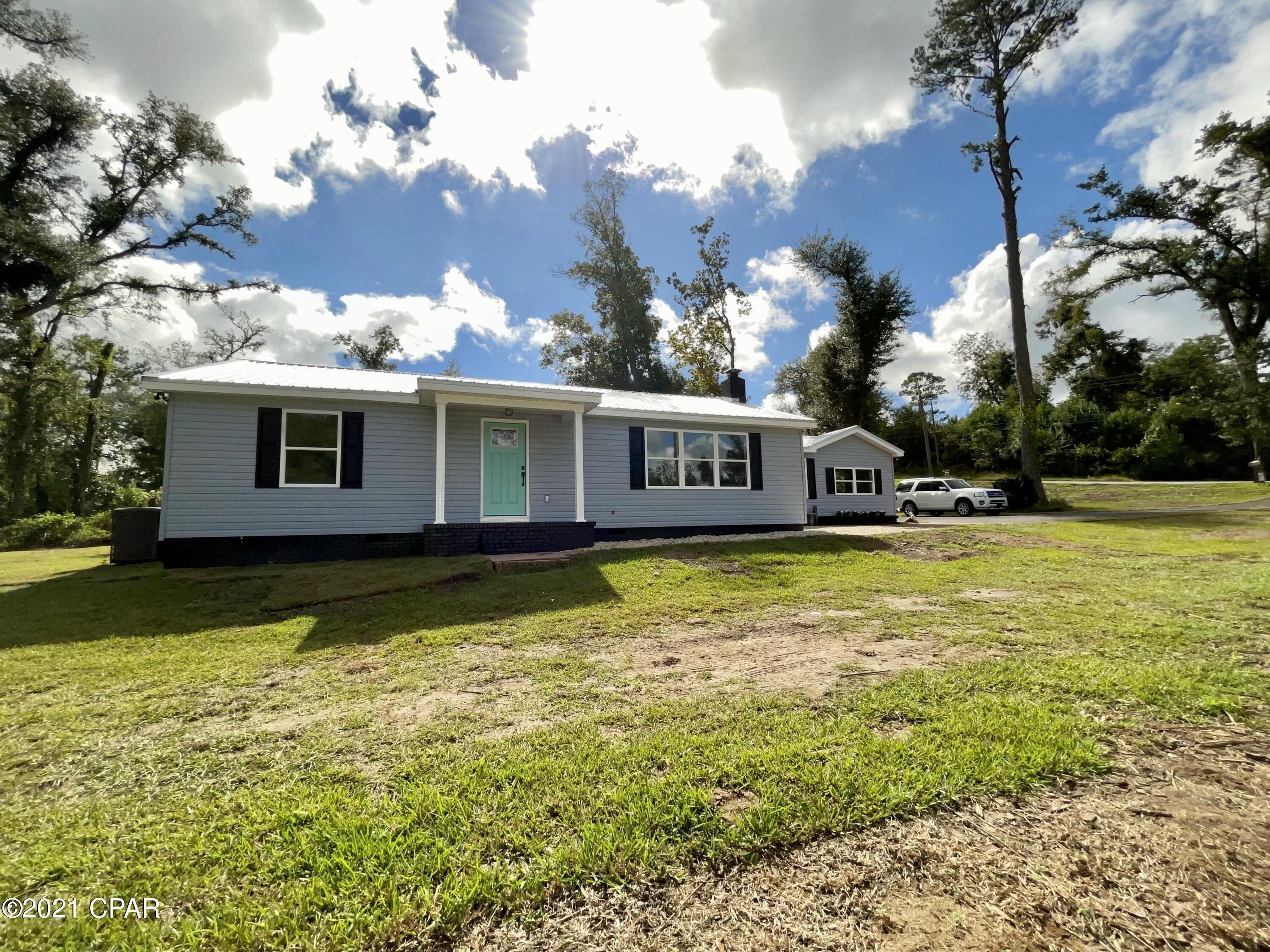 Completely remodeled 4/3 with two master suites located in the city limits of Marianna. Everything here is NEW NEW NEW. Roof, HVAC, wiring, plumbing, asphalt driveway, retaining wall, spray foam insulation, it's ALL brand new. Open floor plan with gorgeous custom cabinetry, granite counter tops, and brand new appliances. Exterior doors can be painted to buyer's preference!! This home speaks for itself and will not last long, make an appointment to see it NOW!