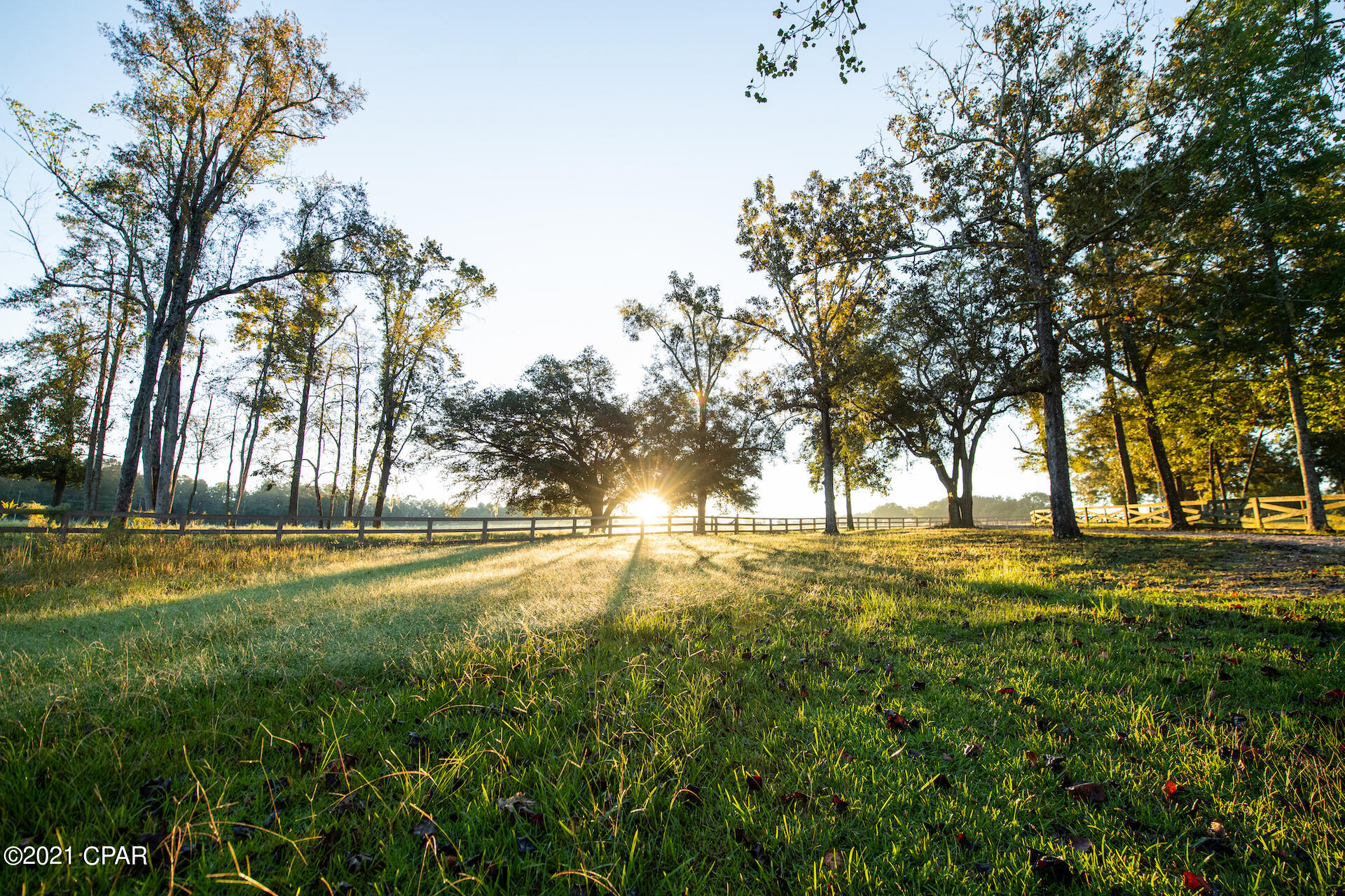 Once in a lifetime opportunity to own a turnkey legacy property in Northwest Florida.  This picturesque 205 acre ranch offers unlimited opportunities for hiking, horseback riding, four wheeling, hunting, fishing or just relaxing with family and friends.  Custom designed 3,600 sq. ft. open floor plan with attention to detail throughout.  Additional features include gunite pool with outdoor cooking area, barbeque  shed with open pit, horse arena with multiple stalls, tack room and exercise room, pistol range, separate cottage, remodeled manufactured home, private dock (to 40 acre stocked lake), enclosed equipment barn/work shop as well as 40x40 recreational room.