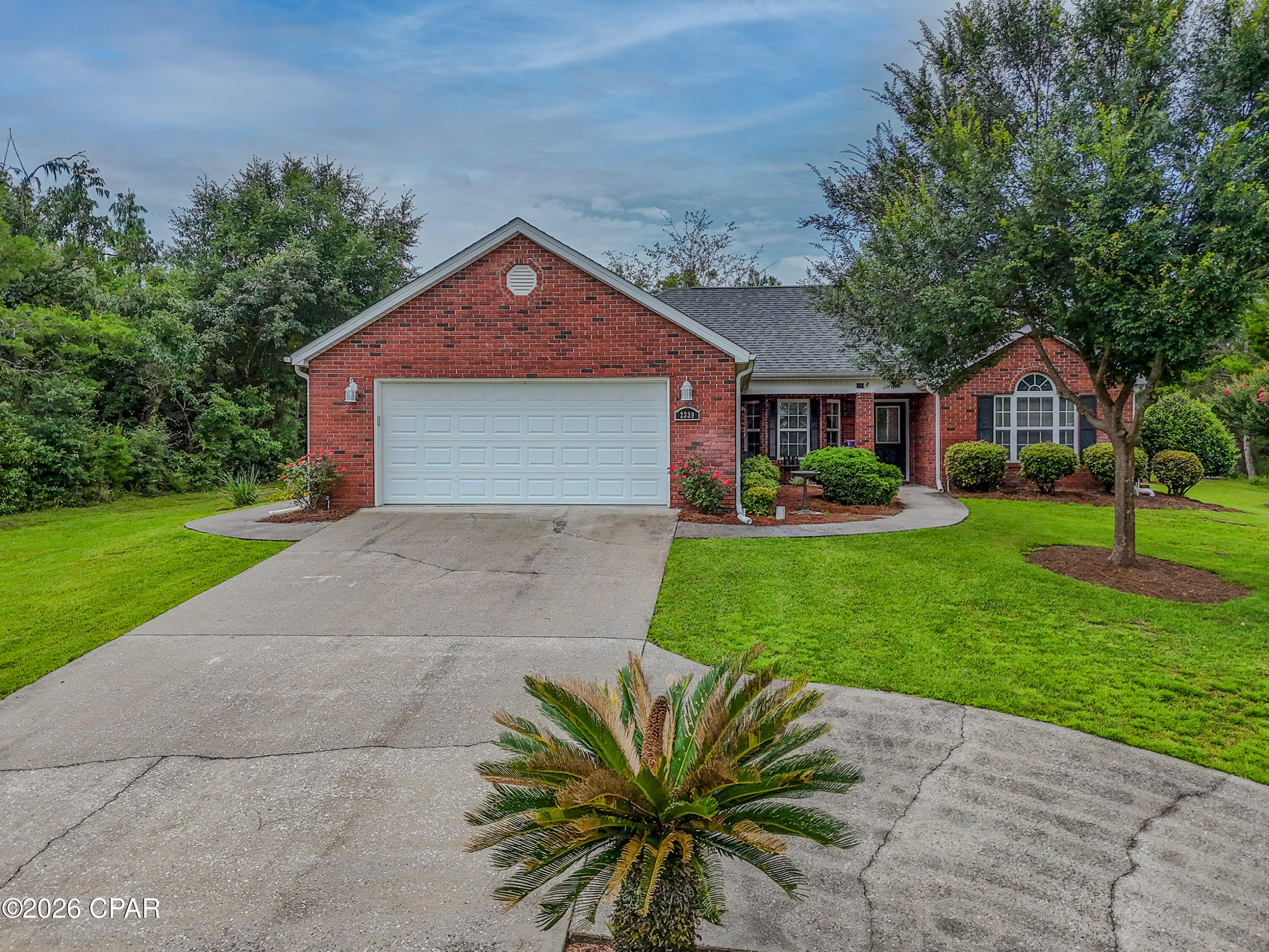 Meticulously maintained, single owner and BETTER than new, this 3-bedroom, 2-bath brick and Hardie siding home offers 1,680 square feet of thoughtfully designed living space, plus a 200 sq. ft. Florida room with wall A/C -- bringing total living space to 1,880 square feet.
Inside, the kitchen and dining nook combination is appointed with nearly new appliances (list available in documents). The main living area features a wood-burning fireplace that adds warmth and character, with a clean mix of tile and carpet flooring throughout. The primary ensuite is generously sized, featuring double sinks, a separate soaking tub and shower, a private toilet closet, an oversized walk-in closet, and a linen closet. The flexible third bedroom -- currently configured as a home office with views into the Florida room -- opens directly to the living area and can easily be restored to a fully enclosed bedroom by adding a sliding or French door (hallway entrance door is stored in the attic). The exterior is equally impressive - the extended driveway allows for easy pull-through or backing, while the beautifully landscaped yard is served by a dedicated irrigation pump and sprinkler system. Entertain effortlessly on the covered grilling patio with a propane-connected grill, and enjoy the peace of a spacious, private backyard. A dedicated storage shed houses lawn equipment, and a 2-car garage and whole-house generator round out an impressive list of extras. Located in the welcoming community of Sunny Hills, this home offers the best of peaceful Florida living with convenient access to everything the region has to offer. Panama City and its coastline are approximately 25 miles south, and the charming town of Chipley is just 18 miles north. Community highlights include the Sunny Hills 18-hole golf course, a public boat ramp, and the beloved Boat Lake -- a quiet retreat for canoeing, kayaking, paddle boarding, swimming, volleyball, horseshoes, and a playground for the little ones. If you are searching for a move-in ready home in a serene setting without sacrificing access to Florida's waterfront lifestyle, this one checks every box.