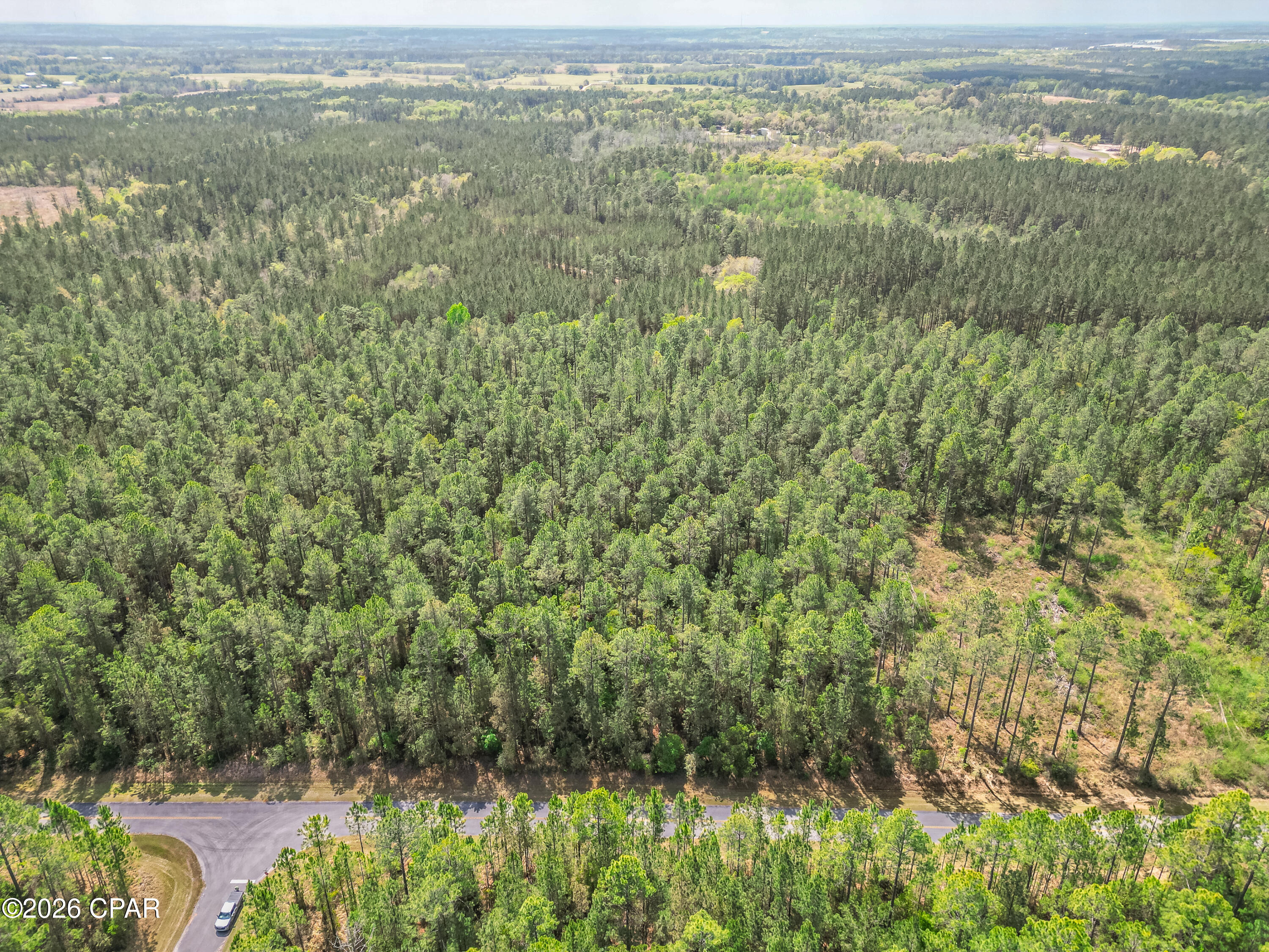 If you've been looking for a quiet place to build with a little room to breathe, this 4 +/- acre homesite in Cypress Crossings is worth a look. Located just west of Vernon, the property is mostly wooded with pine trees and offers a private, natural setting inside a gated community. 
This is a great spot for everyday living. There's space for a home, a yard, and room to enjoy the outdoors without feeling boxed in. Vernon is a short drive away for schools, groceries, and the basics, while the surrounding area keeps that slower, small-town pace that many buyers are looking for.
Getting in and out is easy with paved access from Cypress Crossing Road, just off Parrish Still Road. The gated entrance sits about 1.3 miles north of Creek Road, making it easy to find while still feeling tucked away. You're close enough to town for convenience, but far enough out to enjoy the peace and quiet of country living.
When it comes to recreation, this area has a lot to offer. Holmes Creek and Cypress Spring are nearby and well-known for swimming, kayaking, and boating. And when you're ready for a beach day, Panama City Beach is less than 40 minutes away.
Cypress Crossings has an established HOA and requires site-built homes, which helps maintain a consistent standard. Power is already available underground, but a private well and septic would need to be added. With many of the surrounding lots still wooded, there's room to shape your homesite the way you want, both now and over time. Call today for more information!
Key Features:
• 4 +/- acre wooded lot with mostly pine trees
• Secure, gated entrance (offers both peace and privacy)
• Paved access via Cypress Crossing Rd and Parrish Still Rd
• Underground power available; well and septic needed
• Site-built homes only; HOA $700/year
• Less than 40 minutes to Panama City Beach
• Quiet setting with abundant wildlife and natural surroundings
