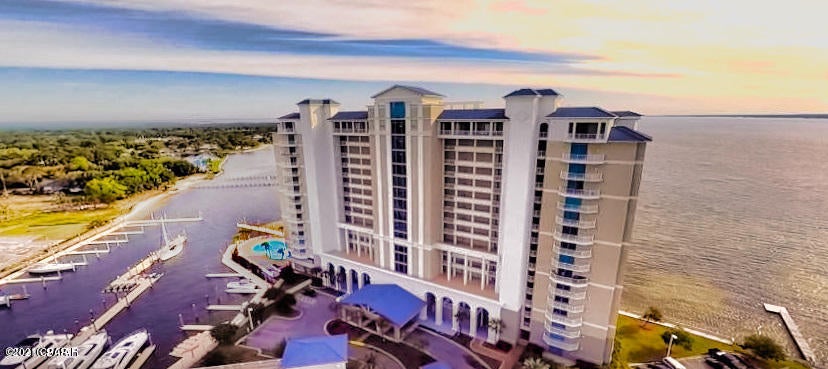 Waterfront living at its finest. This spacious 2 bedroom condominium is well finished with a fireplace, large outdoor patio, gas grill and deluxe master bath. There is a parking lot plus parking deck. Beautiful views of S. Andrews Bay, Hathaway bridge and boat traffic.