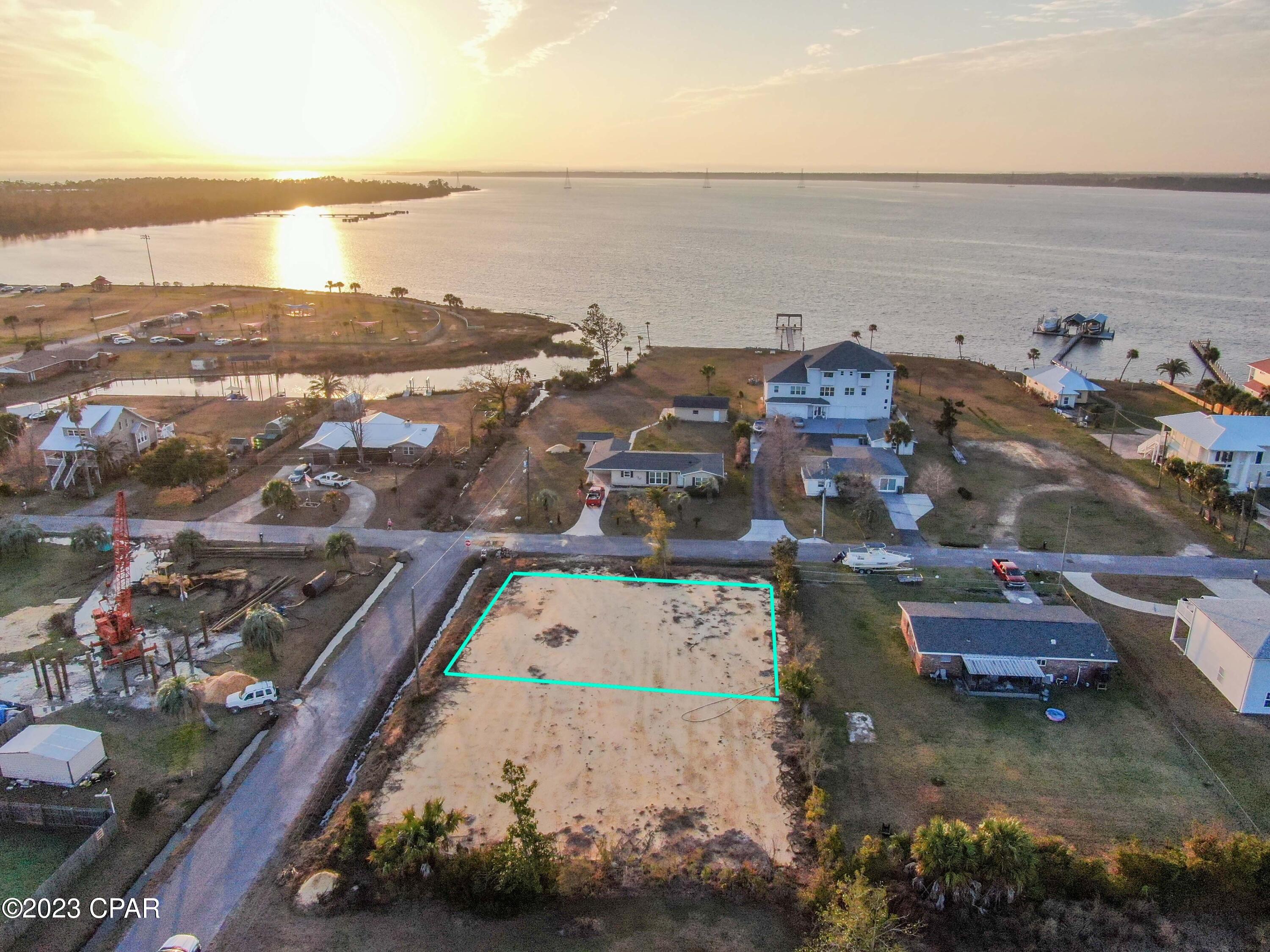 CLEARED 75x100 RESIDENTIAL LOT IN LYNN HAVEN WITH A BAY VIEW. Are you ready to build your next home? This lot is cleared, has water, sewer and electric available (must connect), has No HOA, and is located minutes to schools, shopping, restaurants, boat ramps, and A.L. Kinsaul Park (Dog Park, Splash Pad, Playground, Beach, Kayak Launch, etc). The lot next door is also for sale. Drive by and call today for more information!
