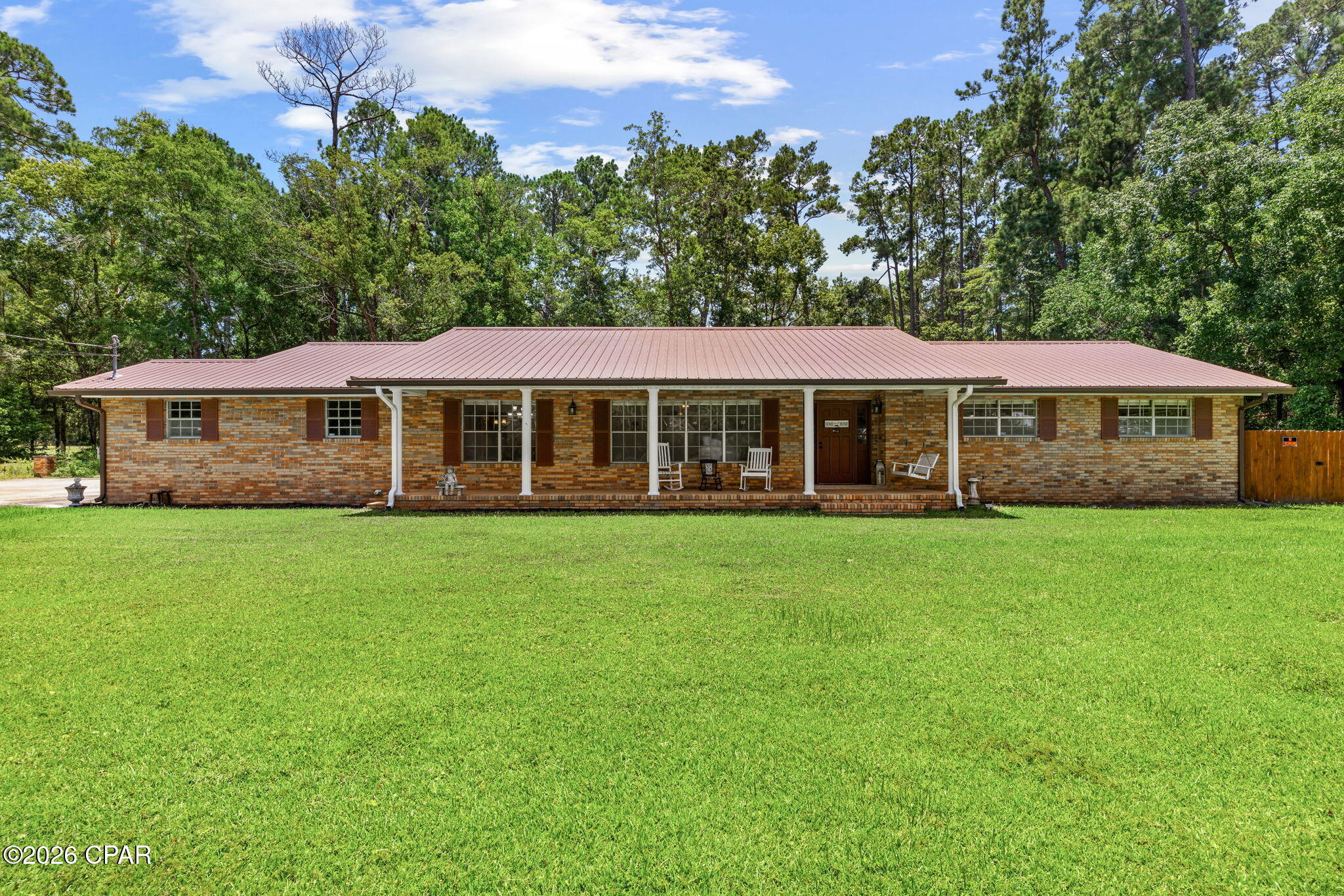 'OPEN HOUSE THUS SUNDAY 8/2 FROM 12-3PM'
Welcome home to this well-maintained 4-bedroom, 2-bath brick home situated on a generous 0.48-acre lot in the heart of Bonifay. Offering the perfect combination of comfort, functionality, and outdoor living, this property is ideal for growing families, those working from home, or anyone looking for extra space to spread out. With an assumable VA loan, This home may also have some great financial opportunity's. 

Step onto the inviting covered front porch and through the front door into a spacious entryway that creates a warm first impression. Just to the left, you'll find a versatile den, perfect for a second living area, home office, playroom, or media room. Continue into the expansive main living room, where a cozy wood-burning fireplace serves as the centerpiece for gathering with family and friends. another great feature you will notice throughout the home is the oversized doorways, these are wide enough for a wheelchair making this home. 

The thoughtfully designed kitchen offers dark custom wood cabinetry, stainless steel appliances, a convenient breakfast bar, and a designated pantry, making meal preparation both functional and enjoyable. Whether you're hosting holidays or casual dinners, you'll appreciate having both a formal dining room and a separate breakfast nook, giving you flexible spaces for entertaining and everyday living.

The oversized primary suite provides a relaxing retreat with his-and-her closets and a private ensuite bathroom. Three additional spacious bedrooms offer flexibility for children's rooms, guest accommodations, a home office, workout space, or hobby room to fit your lifestyle.

Additional features include a dedicated laundry room with a utility sink, a 1-car garage, and numerous recent updates for peace of mind, including a roof that's only one year old, a two-year-old HVAC system, and new gutters.

Outside, you'll find a large covered back porch overlooking a spacious privacy-fenced backyard, providing plenty of room for entertaining, pets, gardening, or simply enjoying your own private outdoor oasis.

Conveniently located in the heart of Bonifay, you'll enjoy small-town charm while remaining just 47 miles from the sugar-white sands and emerald waters of Panama City Beach, making weekend getaways an easy drive.

If you've been searching for a move-in-ready home with generous living space, modern updates, and a fantastic location, this home is ready to welcome you.