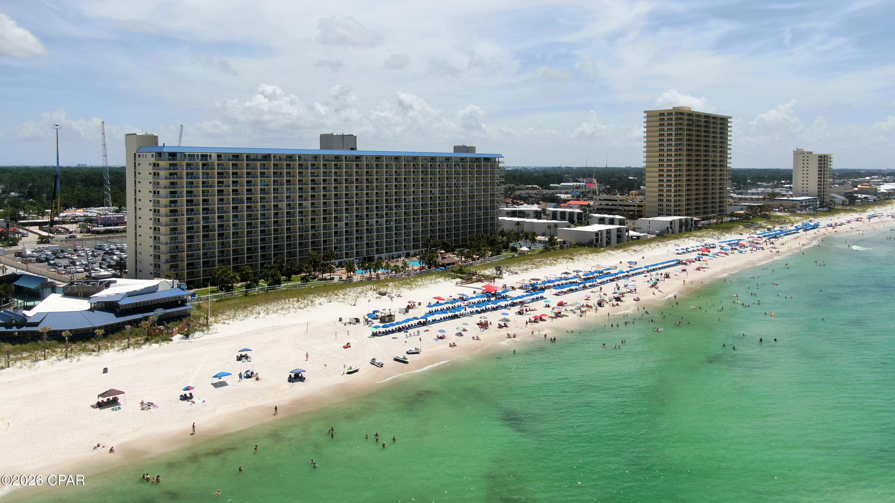 Welcome to one of the most compelling investment opportunities on Panama City Beach. Positioned directly beside the all-new Tootsie's Orchid Lounge--now occupying the legendary former Spinnaker Beach Club--The Summit is poised to benefit from one of the area's biggest new entertainment destinations. This high-profile addition is expected to drive increased visitor traffic, extend guest stays, and strengthen rental demand, making an already proven income-producing resort even more attractive to investors.

The Summit has long been recognized as one of Panama City Beach's premier short-term rental destinations, with decades of strong rental performance. Its unbeatable Gulf-front location, extensive resort amenities, and walkable access to restaurants, nightlife, attractions, and family entertainment continue to deliver exceptional appeal for both owners and vacationers.

This fully furnished, rental-ready condo offers unobstructed Gulf views from its private balcony and features several valuable updates, including an upgraded tile walk-in shower, new windows, a new sliding glass door, new balcony railings, and an in-unit washer and dryer. The thoughtfully designed floor plan includes a king bedroom, hallway bunk beds, and a convenient half bath.

Guests enjoy an unmatched resort experience featuring two Gulf-front swimming pools (one seasonally heated), children's pools, indoor and outdoor hot tubs, saunas, a fitness center, tennis and pickleball courts, shuffleboard, a poolside tiki bar, on-site dining at Bikini Bob's, barbecue and picnic areas, gated 24-hour security, and private beach access. Across the street are amusement attractions, restaurants, shopping, and entertainment, creating the convenience today's vacation renters actively seek.

Whether you're expanding your investment portfolio or purchasing your first beachfront income property, The Summit continues to prove why it remains one of Panama City Beach's most dependable cash-flowing condominium communities. With the arrival of Tootsie's adding a powerful new demand driver next door and this unit's recent upgrades already in place, the future potential has never looked stronger.

All information is deemed reliable but should be independently verified by buyers if important.