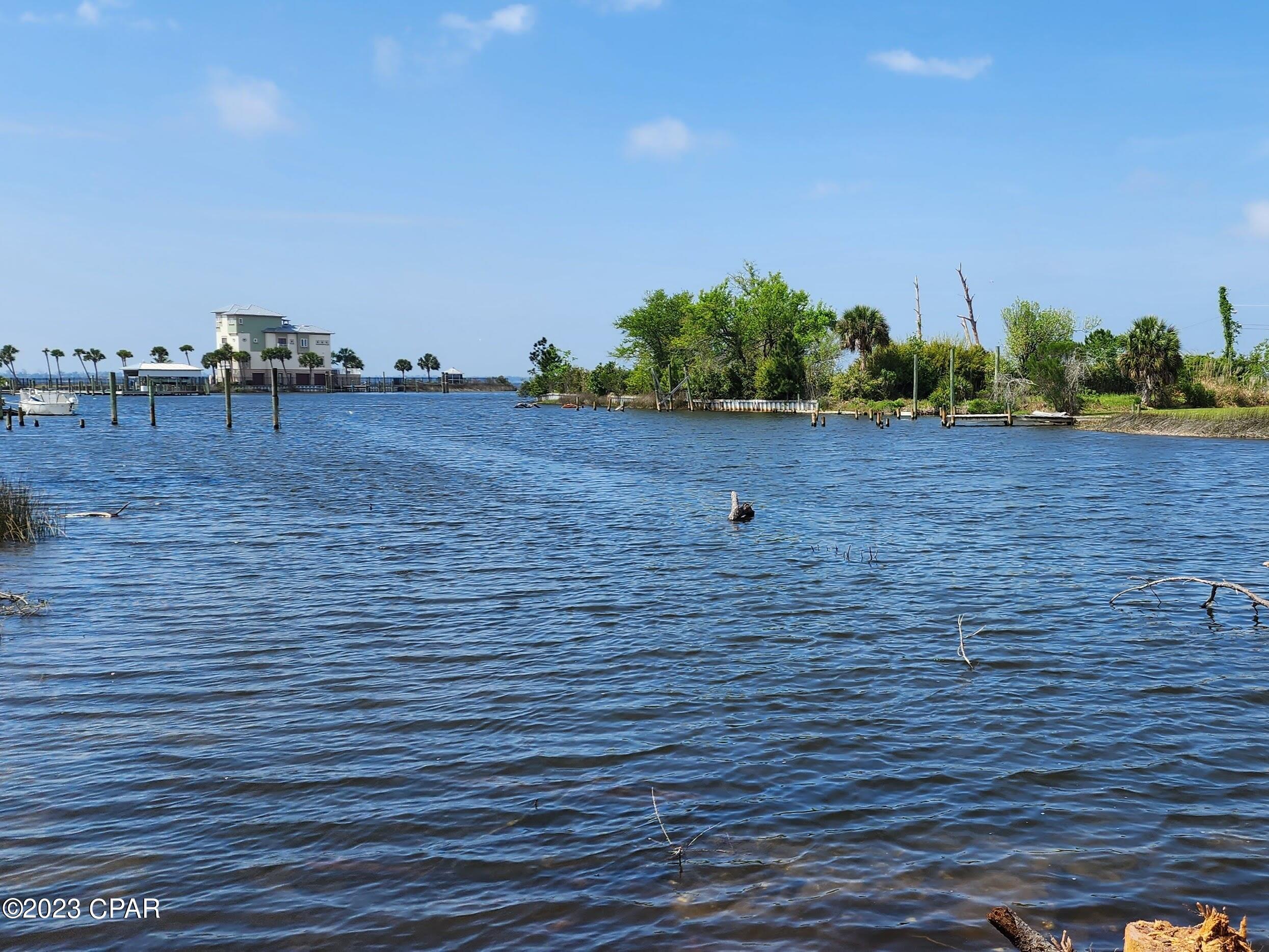 Bring offers - let's talk! This 1.5 acre waterfront paradise has been absolutely transformed. It previously had a large, abandoned home with a pool and pool house that all needed demolition. All of that has been complete, debris removed, fill dirt brought in, overgrown brush cleared, land surveyed, lots split, and now it's a blank canvas ready for your dream home... or two dream homes! Located on Emmons Bayou at East Bay, each lot has over 100' of water frontage and would be perfect for a dock. Bring your boat, kayaks, Sea-Doo, etc. Great for fishing. You need to come see this location! Sweeping panoramic views; catch both the sunrise over East Bay and the sunset over the bayou! Purchase the lots combined for $310k or separately for $160k (Lot 13) or $170k (Lot 14). No HOA here and very few cars passing on this dead-end street. The surrounding area includes the gated East Bay Preserve and Yacht Club plus several million+ dollar homes with more being added. Very convenient location that's less than 10 minutes from Tyndall AFB, community parks, lots of restaurants, and shopping. Plus it's an easy drive to Mexico Beach or Panama City Beach. Excellent investment opportunity - come take a look today!