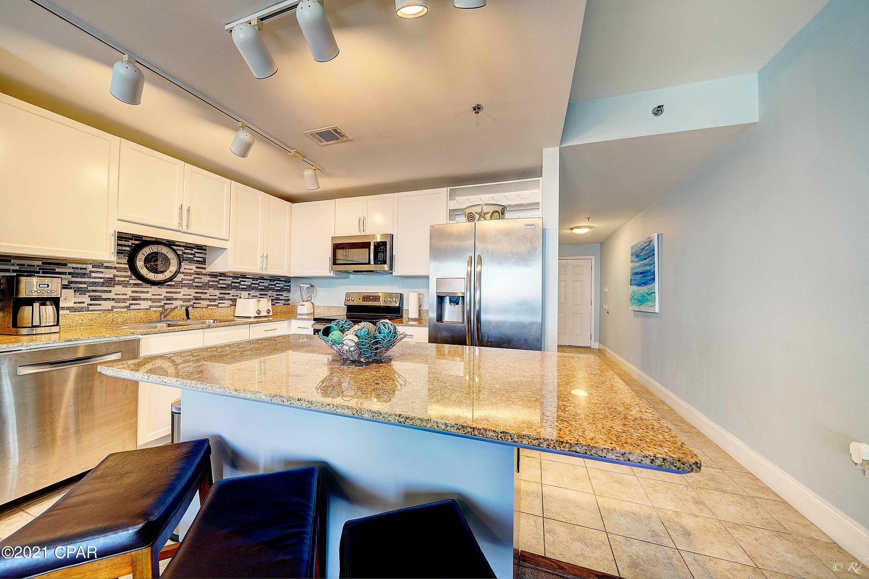 BEAUTIFUL GULFVIEWS of horizon!!!!! Beautiful turn key 2 bed, 2 bath PLUS bunk room condo with water views all around!!!! These are some of the largest units on PCB. New appliances 2021, washer/dryer 2018, 65'' TV 2021, furniture 2018, 43'' TV 2018, A/C 2020, water heater 2019. The bedrooms are large. Main bath boasts large garden tub and walk-in shower. Amenities include 5 pools, 2 hot tubs, putting green, spacious fitness room overlooking the Gulf, light show nightly at 8pm. It's within walking distance to Walmart, shopping, Pineapple Willies, and 3 public beach accesses directly across the street. All measurements are approximate, please verify.