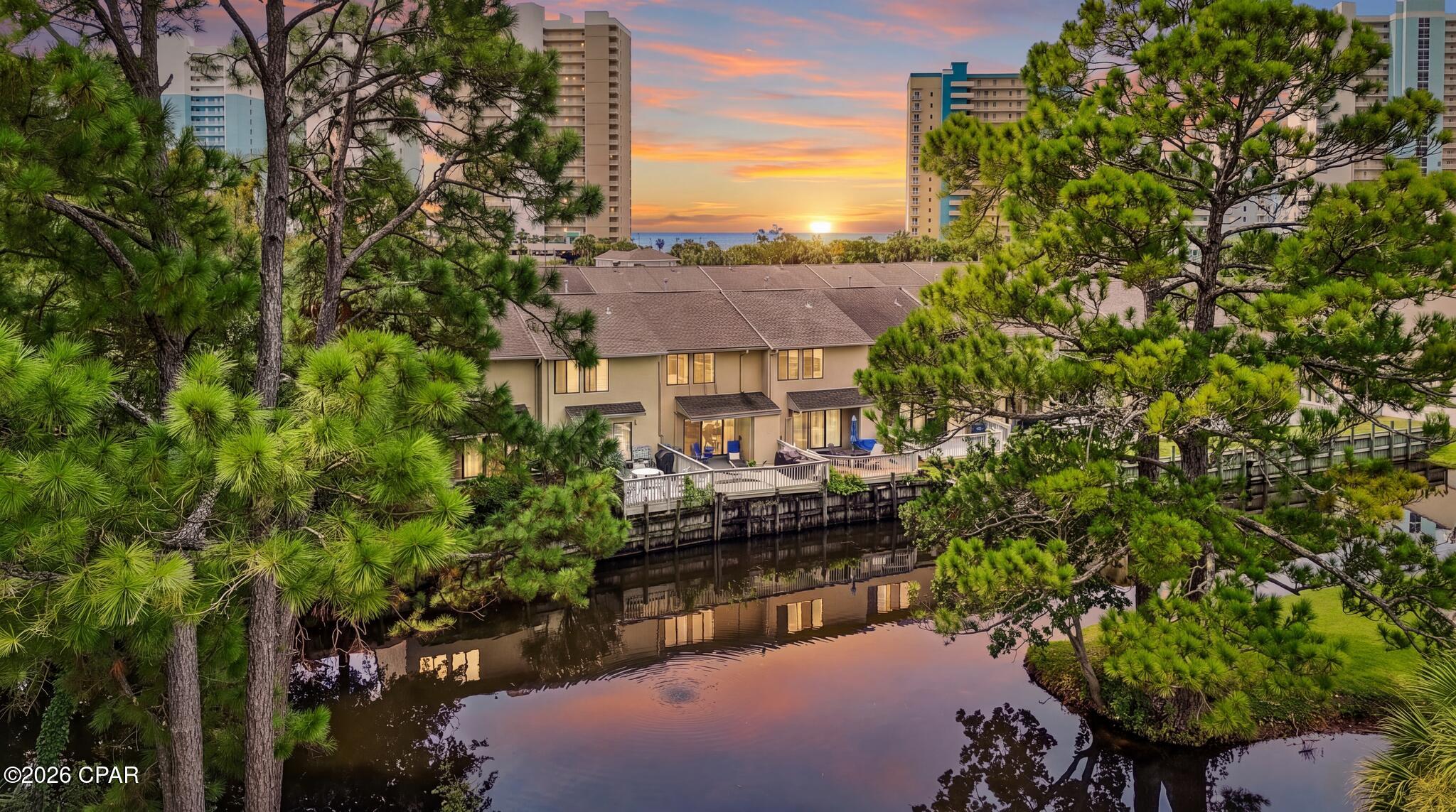 Welcome to Panama City Beach living at its finest! Nestled in the highly sought-after, VA-approved community, this stunning 2-bedroom, 2.5-bath townhome offers the ultimate blend of comfort, style, and investment potential.
this meticulously updated unit showcases peaceful water views of the wide canal and a bright, open-concept feel throughout. One of the unit's absolute best features is its prime location right next to a private owner's entrance, offering exceptionally quick and convenient access in and out of the community.
Step outside and enjoy an unmatched resort lifestyle. The community boasts incredible amenities, including 11 pools (several heated), tennis and pickleball courts, two fitness centers, an 18-hole mini-golf course, playgrounds, shuffleboard, and an exclusive private beachfront clubhouse with a snack bar.
Conveniently located just a short walk to the sugar-white beaches, local dining, shopping, and everyday conveniences like Walmart and the post office. Whether you are looking for a full-time residence, a lucrative short-term rental investment, or a dream vacation getaway, this exceptional canal-front townhome delivers. Don't miss out--schedule your showing today!