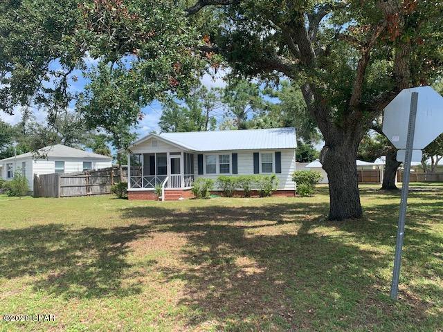 Fantastic Florida cottage located in the historic district of St. Andrews.  Just a short walk to Lake Huntington and St. Andrews Bay.  Also very close to Downtown St. Andrews with several restaurants, coffee shops, and shopping.  This cottage features sits on a corner lot with large shade tree oaks, original hardwood floors, den, screened in front porch, and detached covered carport with storage.