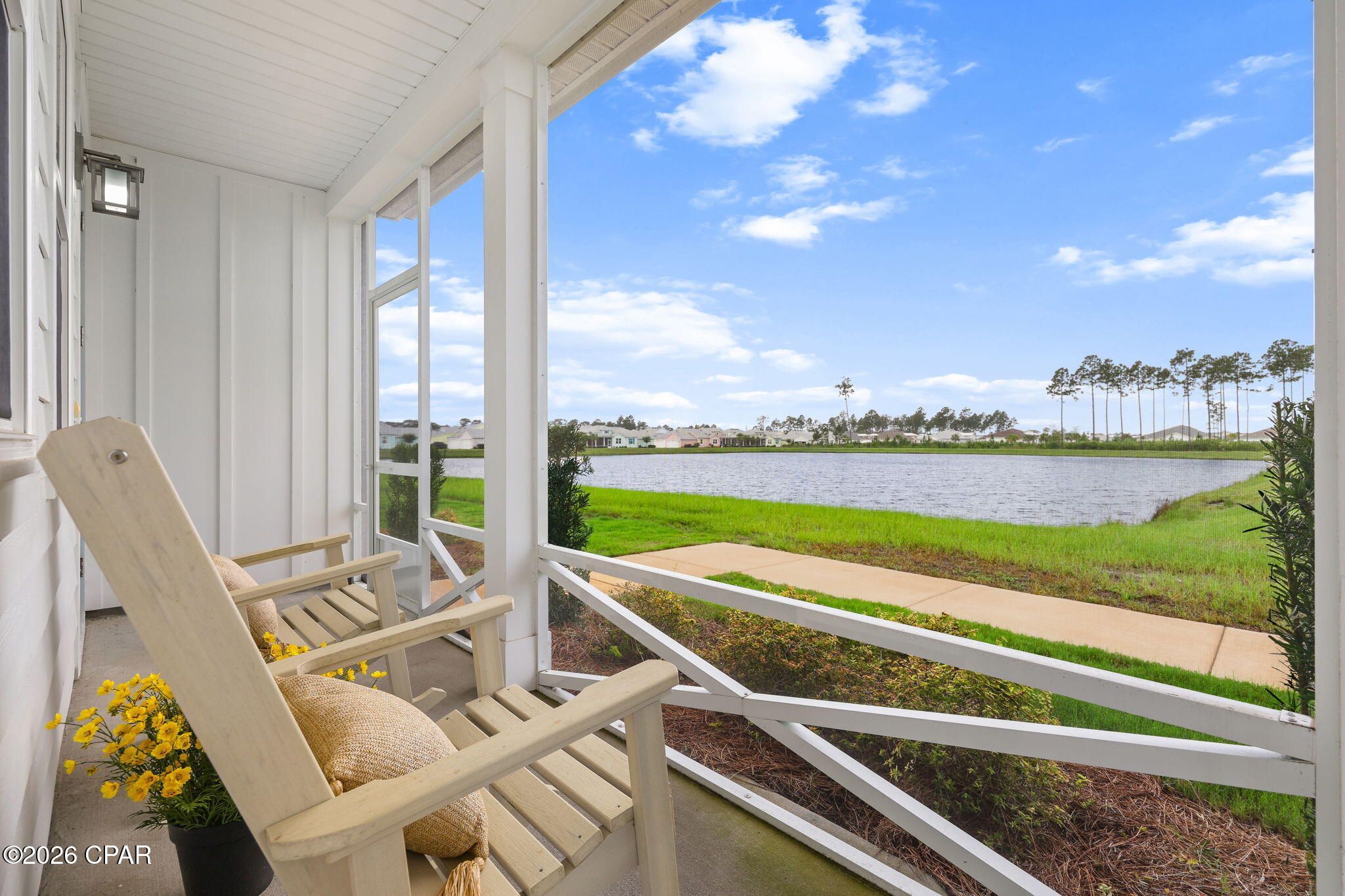 Rare Waterfront Dreamsicle Cottage in Latitude Margaritaville Watersound, Phase 4 close to the amenities. This beautifully Dreamsicle floor plan offers 2 bedrooms, a flexible den/office, 2 bathrooms, and an exceptional lakefront setting with breathtaking western-facing sunset views over the water.

Designed for Florida's indoor-outdoor lifestyle, the home features a spacious screened wrap-around lanai and panoramic waterfront views. A green space lead directly to the lake, creating the perfect setting for entertaining, relaxing, or enjoying peaceful evenings by the water.

Inside, you'll find a bright coastal-inspired interior with an open-concept layout, soaring cathedral ceilings, and stunning water views from the Great Room, dining and second bedroom. The upgraded kitchen features white cabinetry, granite countertops, and abundant storage, while luxury vinyl plank flooring flows throughout the home for a seamless, low-maintenance finish.

The thoughtfully designed split-bedroom floor plan provides privacy for owners and guests alike. The guest suite is located adjacent to a full bath, while the versatile den offers endless possibilities as a home office, hobby room, media room, or additional guest space.

Additional benefits include a remaining builder 10-year structural warranty and Cottage HOA coverage that includes scheduled exterior repainting and roof replacement, providing peace of mind and exceptional value.

Residents enjoy the award-winning Latitude Margaritaville lifestyle featuring:

* Resort-style pool and indoor lap pool
* State-of-the-art fitness center
* Pickleball, tennis, and sports courts
* Walking and biking trails
* Full-service two-story waterfront restaurant overlooking the Intracoastal Waterway
* Live entertainment, social clubs, concerts, and year-round activities

Conveniently located approximately 7 miles from Panama City Beach and near the new Publix-anchored shopping center and expanding medical corridor, this home offers the perfect combination of waterfront tranquility, resort-style amenities, and everyday convenience.

Don't miss this rare opportunity to own a waterfront cottage with sunset views in one of Florida's premier active adult communities on the Emerald Coast.