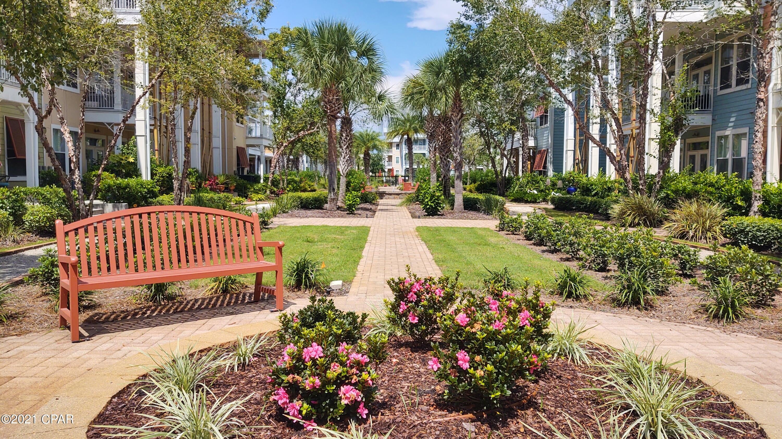 CURRENTLY UNDER CONTRACT, SELLER ACCEPTING BACKUP OFFERS.Investor's Dream with some TLC! This 2BR/2.5 bath condo is located in beautiful Island Reserve, a gated community in the heart of PCB!  The condo is very spacious & features bamboo floors, stainless steel appliances & granite counters in the kitchen, 10' ceilings with some crown molding & lots of closet space.  The balcony off the unit has a garden view & the outside of buildings were recently updated.  On-site amenities include a 1-acre lagoon style pool with fountains,  fitness center & basketball court, gaming room, movie theater & beautifully landscaped courtyards.  The complex is less than a 5 minute drive to the beaches & 15 minutes from Pier Park.  Photos shown NOT from unit, but a like floor plan.  All info is app