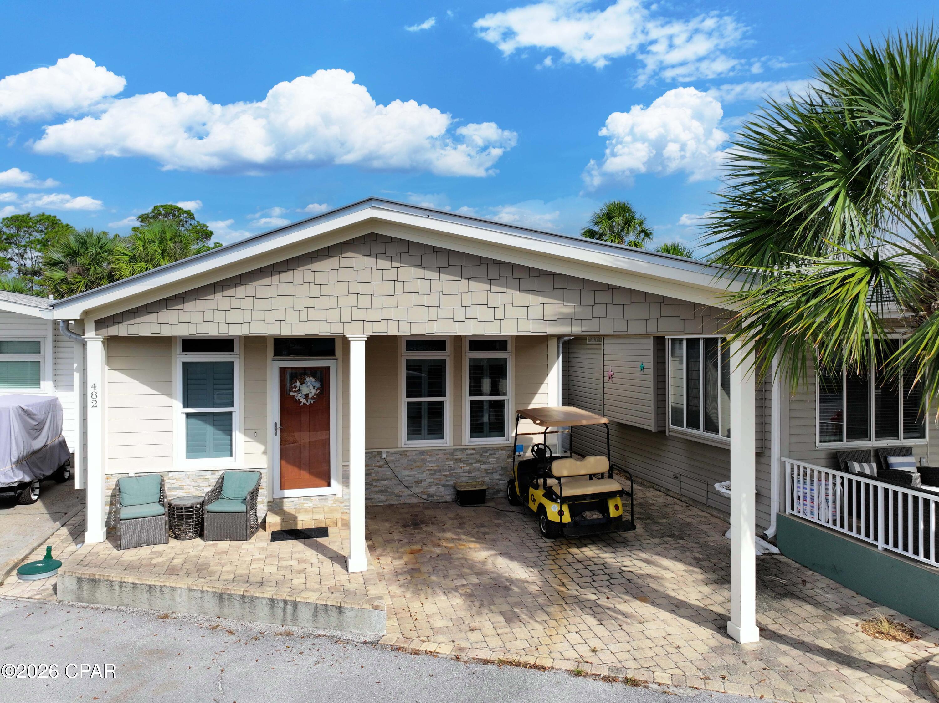 Here is a rare opportunity to own a luxury 3 bedroom, 2.5 bath coastal home in Venture Out that backs up to St. Andrews State Park. This house was built by one of the best builders in Bay Co and is full of detailed craftsmanship.  The master has a queen size bed, the second guest bedroom has a queen bed, and the third bedroom has queen size Murphy bed. This beautiful coastal home comes fully furnished and ready to be a vacation home or an investment property.  The kitchen has quartz countertops, high end stainless steel appliances and loads of cabinet space.  The home has linens included (bed sheets, bath towels, hand towels), washer/dryer, dishwasher, golf cart, all the utensils making it turn key. Enjoy the evening sitting on the back patio watching the deer and other wildlife go by or sit on the front porch and enjoy the people as they pass by. You can also take the golf cart for a short two minute ride to the beach, cruise around the neighborhood, or go sit at the back of the resort and watch the boats and dolphins in the lagoon. There are also many restaurants and family friendly activities that are just minutes away.

Located on the most desirable lot backing up to the State Park - great backyard - beach and bay property - 2 community pools - tennis - putting green - shuffleboard - boat dock - fishing dock - golf cart community.  All measurements are approximate - please measure to verify.
