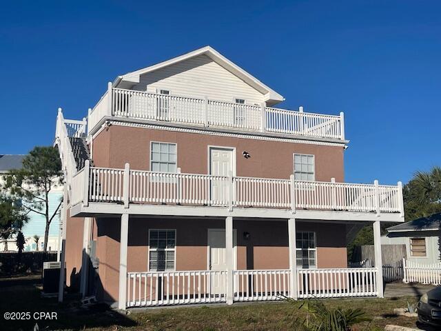 Great investment property! Three units, two 2-bedroom units and one studio, just steps from Beach Access 50. Beautiful view of The Gulf from the thitd story deck. This long term investment rental is right across the street from the park and features lots of parking, a spacious back yard and is within walking distance of many restaurants and bars. All measures approximate, please verify if 100% accuracy is needed.