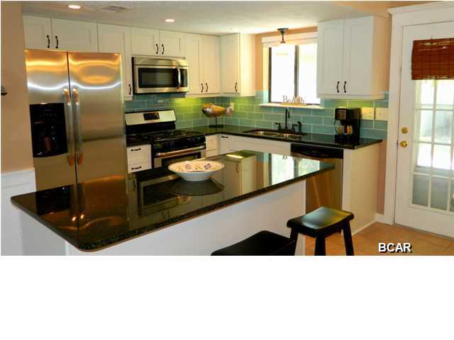 This 2 bedroom, 2.5 bath town home is situated in the gated community of Gulf Highlands. Downstairs offers an open floor plan and features the living area, kitchen, dining area, and half bath. The nicely shaded back patio has outdoor space for grilling out and there is gas grill and patio set provided for your enjoyment. Upstairs you will find a master bedroom with pillow top king bed and an adjoining master bathroom with stand up shower. Located off the master bedroom is a balcony that overlooks the patio area. The guest bedroom is just down the hall and has two twin beds. There is a second bathroom upstairs for the guests with a tub/shower combination. Beach access and the beachfront pool is approximately 350 yards through the complex and is available by crossing over Front Beach Rd. Washer/Dryer included. No pets. Rent includes all utilities but electric. Property cannot be unfurnished. 6 month lease term available. Lease term under 6 months subject to 13% tax.