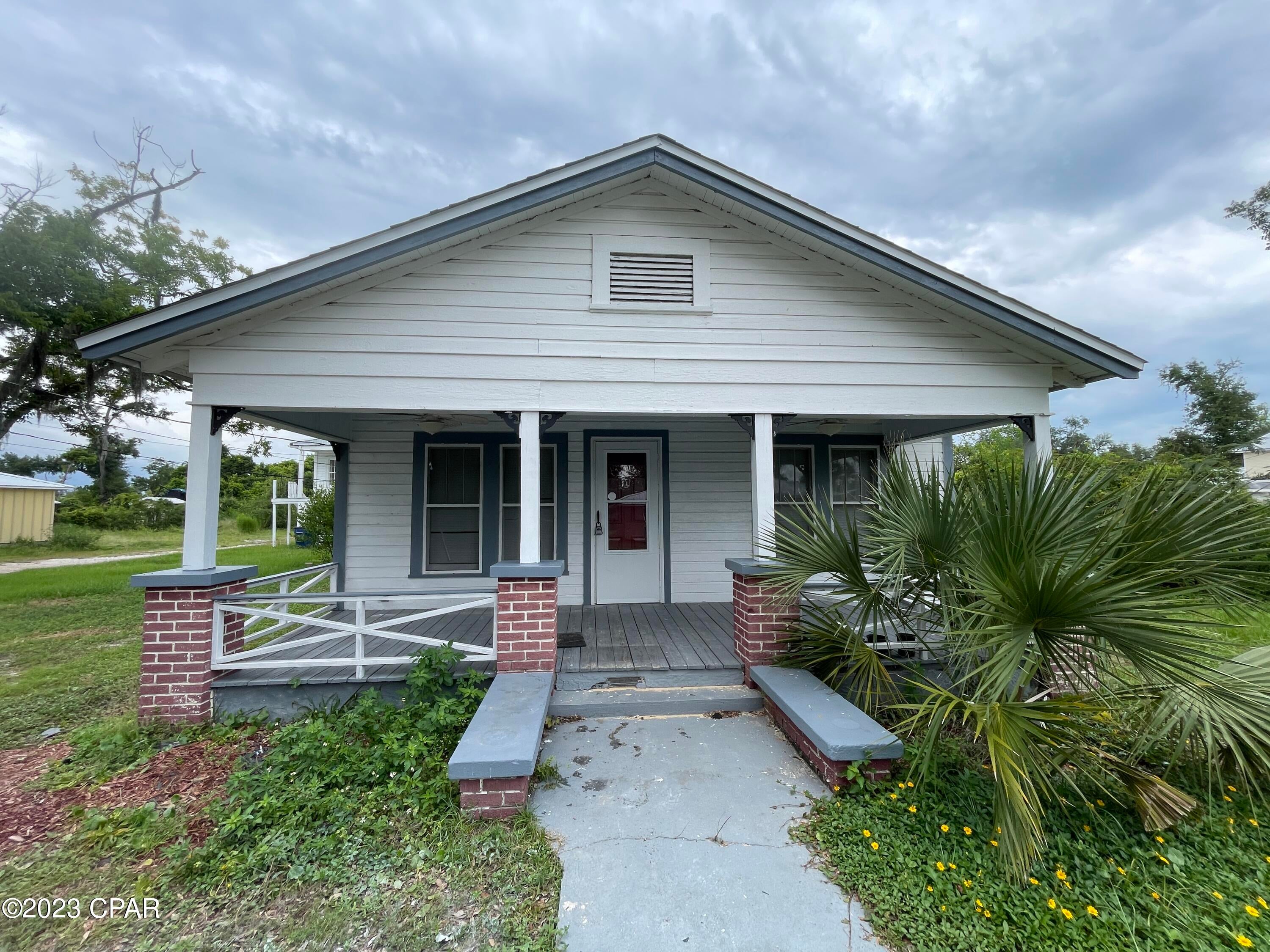 For Lease - 3 BR | 1 BA charming home with character and modernizations! The home was just updated with all new vinyl plank flooring throughout, new ceiling fans, and fresh white paint. The front porch is perfect to sit and enjoy a morning coffee. As you step inside, you'll find a large living room flowing into another flex space room where you could set up a formal dining area, play area or a home office. The kitchen offers stainless appliances with a gas range, new refrigerator, and ample counter space and cabinet storage with a unique, charming corner cabinet with glass doors. There are three bedrooms and a shared hallway bath. The laundry room area has washer/dryer hookups in the back of the home leading to the backyard patio area. This is a true Old Florida Charmer updated and ready to make a home. **Pets negotiable upon approval with $350 non-refundable pet fee. *Rent Includes Water/Sewer, Garbage