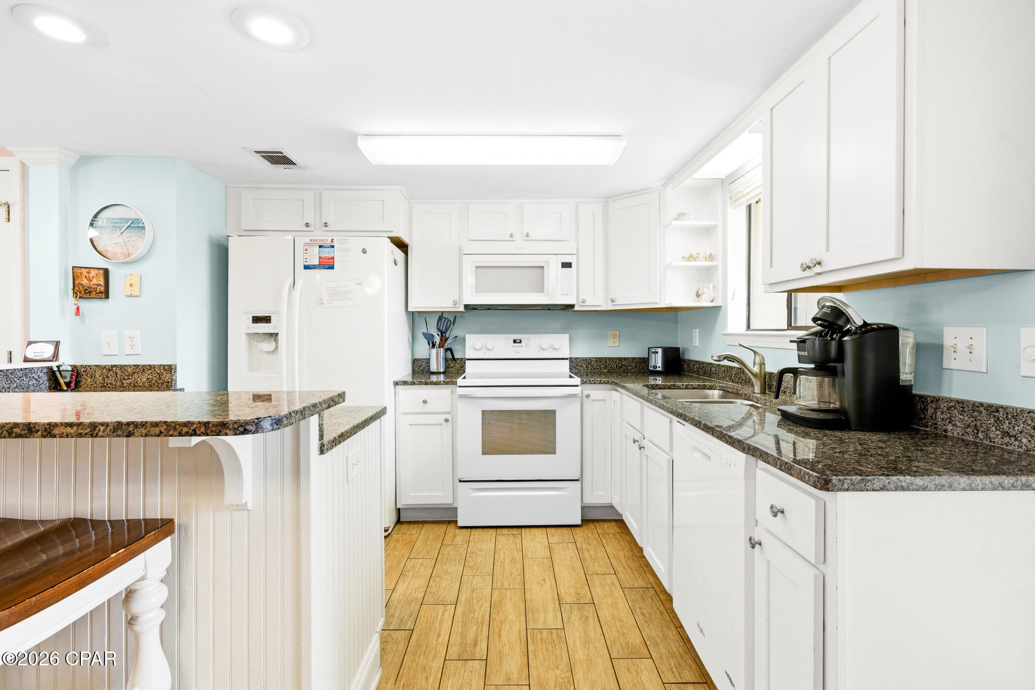 ROOF 2019. Two deeded parking spots with EXTRA ROOM for GOLF CART PARKING. Gulf Highlands Resort features many amenities including 11 pools (5 heated in winter), pickleball, tennis, shuffleboard, 2 playgrounds, gym, and a beachside clubhouse with a restaurant and pool right on the sand! Grab this for your family vacations and let the rental income offset your expenses. At Gulf Highlands Beach Resort, every season is Beach Season!
Age, SF, and dimensions approximate.