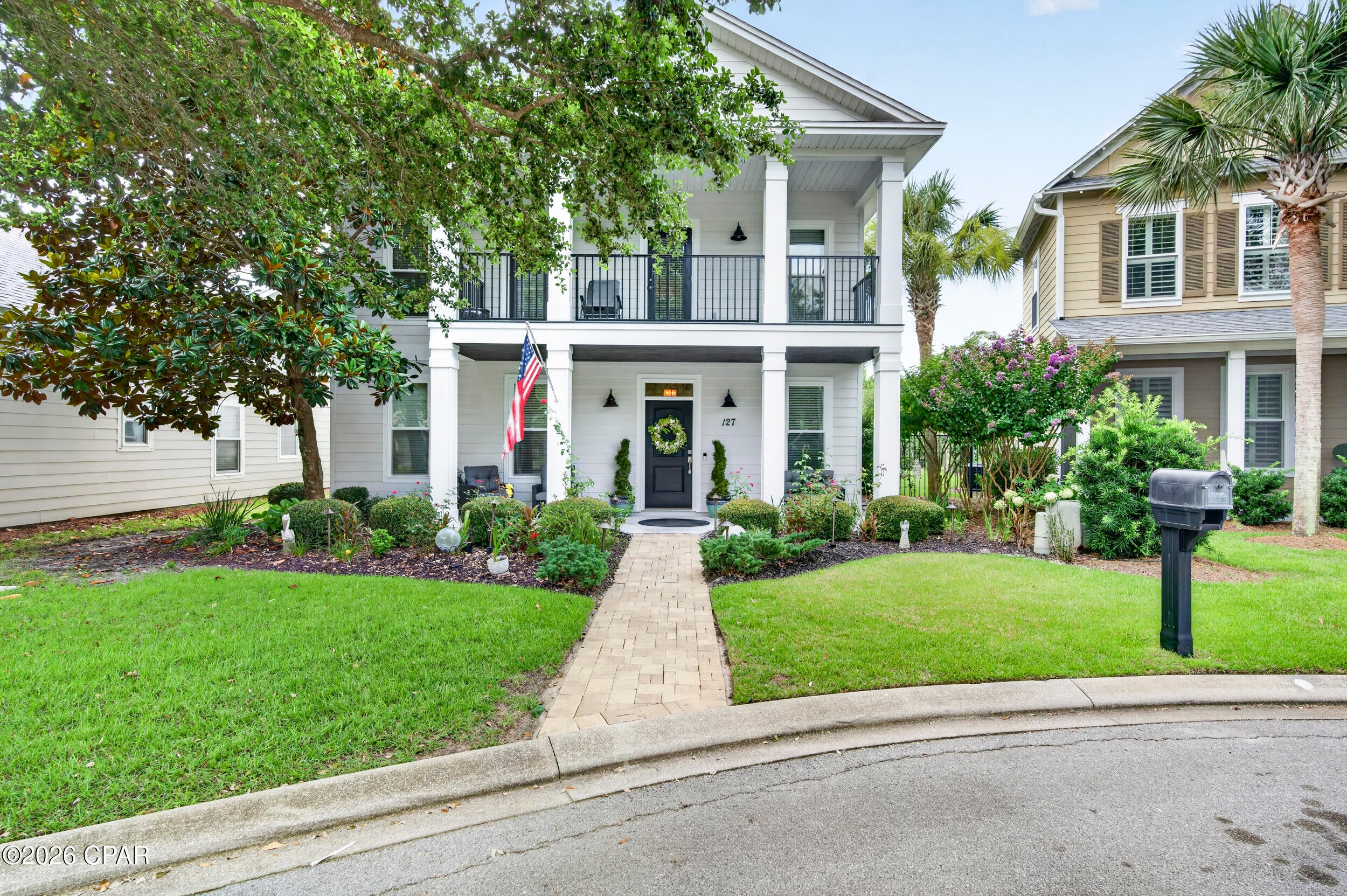 Where coastal charm meets everyday luxury, welcome to 127 Terrapin Close. Nestled in one of Panama City Beach's most desirable residential communities, this beautifully maintained 5-bedroom, 2.5-bath home offers over 2,400 square feet of thoughtfully designed living space just minutes from the area's sugar-white beaches, Pier Park, Frank Brown Park, and Northwest Florida Beaches International Airport. The open-concept floor plan seamlessly connects the living, dining, and kitchen areas, creating an inviting space for entertaining and everyday living. The updated kitchen features granite countertops and custom cabinetry, while the first-floor primary suite offers privacy and convenience. Upstairs, four additional bedrooms and a versatile loft provide flexibility for family, guests, a home office, or playroom. Enjoy your morning coffee on the screened porch or unwind on the balcony after a day at the beach. Oversized closets, a spacious two-car garage, and recent HVAC updates add comfort and peace of mind. Unlike many Panama City Beach communities, short-term rentals are prohibited, preserving the neighborhood's peaceful residential atmosphere. Residents also enjoy resort-style amenities including a community pool, clubhouse, pickleball and tennis courts, an amphitheater, and beautifully maintained common areas. This home offers the perfect blend of coastal living, modern comfort, and an exceptional location.