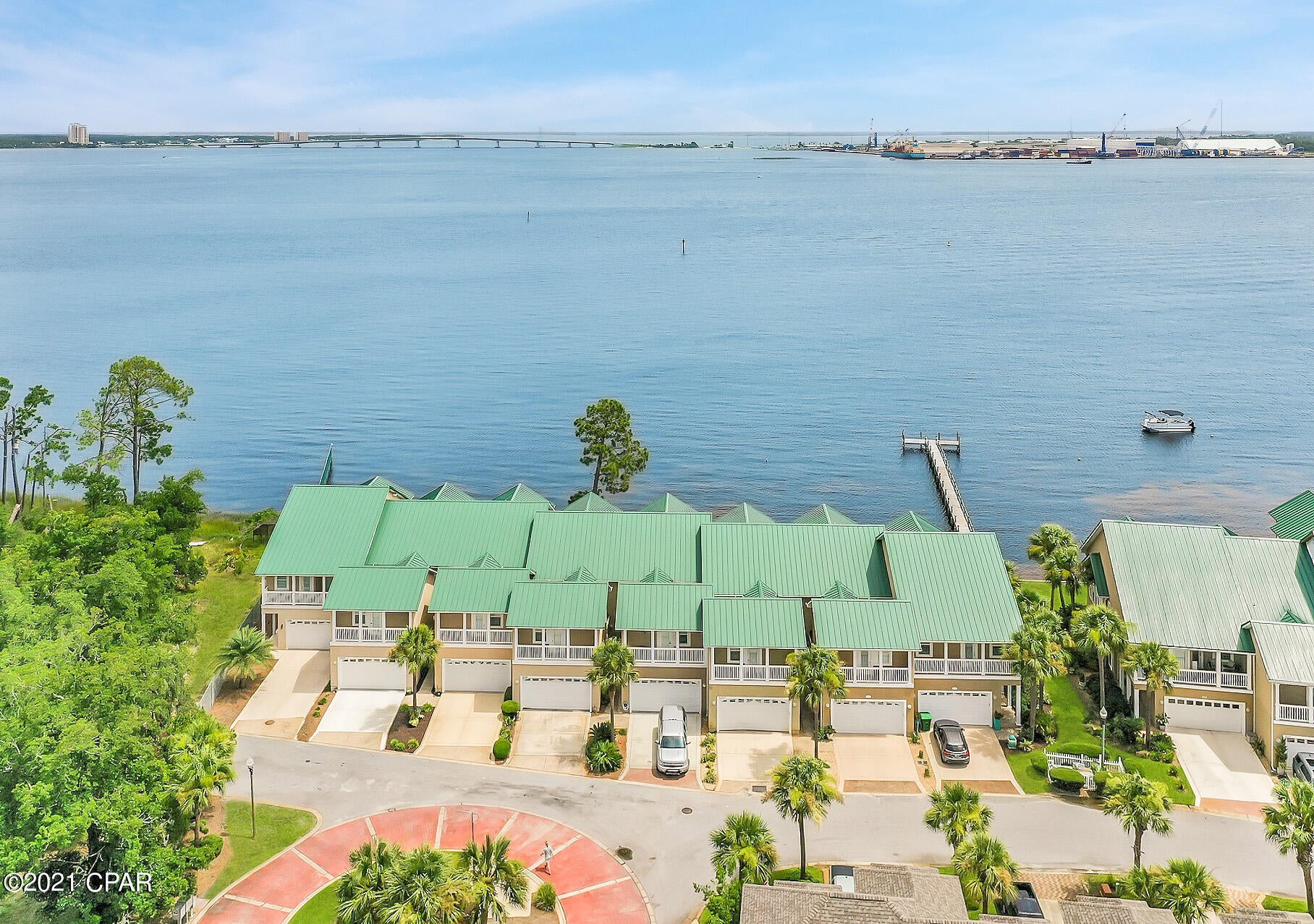 Privacy, serenity and pleasure all come together to create the perfect oasis of waterfront living on the Bay. A rare find with a 2-car garage, solid concrete construction, pure views of the Bay, but without the maintenance. Wake up each morning in your waterfront master suite to gorgeous sunrises from your private balcony and spend each night relaxing on the docks watching the sunset. Moor your boat for a few days behind your townhome and enjoy the waterfront lifestyle you desire! Very spacious with an open floor plan and  high ceilings. Light, bright and airy throughout, this home is turn-key with amenities you'll never want to leave. In the highly regarded community of Pelican Bay, off Magnolia Beach Road, this bay front townhome offers endless views, peaceful surroundings & Gulf access. This recently renovated townhome offers a 2-car garage, covered patios on the main living room and master suite as well as three spacious bedrooms and 2.5 bathrooms. 9' ceilings, LVP flooring, crown molding, black stainless appliances and plenty of storage throughout. Residents can enjoy the clubhouse with a full kitchen, bay front pool & spa, two community docks and nature walk. This townhome is waterfront living at its absolute finest!