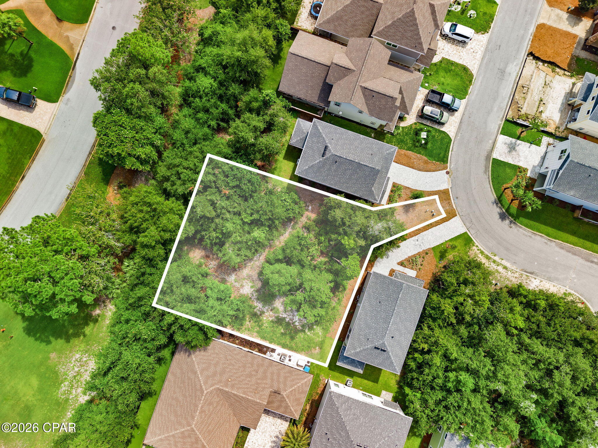 MAJOR PRICE REDUCTION -- NOW OFFERED AT $115,000! An exceptional opportunity to build in gated Sanctuary Beach at a price that deserves a second look. Located at 3526 Cottage Cove Lane, this spacious 0.19-acre homesite is one of the larger lots in the subdivision and backs directly to the dedicated green space of Dragon's Ridge, creating a beautiful natural backdrop with added privacy and a peaceful setting.

Design and build a custom coastal home with room to incorporate the indoor and outdoor living spaces that fit your lifestyle. For buyers who may have difficulty envisioning the possibilities of a vacant homesite, preliminary house and floor plans are available upon request to help bring the potential of this property to life.

Sanctuary Beach offers the privacy of a gated residential community while keeping you conveniently close to Panama City Beach's beautiful beaches, marinas, boating, dining, shopping, and entertainment.

With its generous lot size, green-space setting, desirable location, and new price of just $115,000, this is an opportunity to secure your piece of Panama City Beach and start creating the home you've been envisioning.