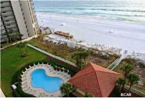 Coral Reef is a complex that will reel you in and make you a proud owner. Only 14 stories high, this 2 bedroom-2 bath unit has large bedrooms and a big kitchen with a grand total of 1568 square feet (The total includes the 141 square foot balcony that is great for watching the awesome sunsets.) Well maintained, you will find an exercise room on site, a gorgeous view of the sugar sands and emerald waters, a large parking lot, 2 swimming pools - (one is heated), a covered drive-through entrance for unloading on a rainy day, and a totally beautifully furnished and rental ready condo with 9 foot ceilings on the popular 9th floor. The million dollar view can be yours for a fraction of the cost! Plan to see it today, and bring your checkbook.