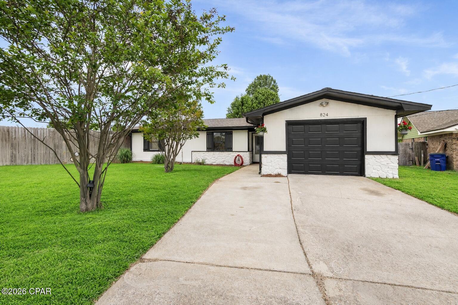 Charming single-family home on a generous 1/2 acre lot at the end of a quiet cul-de-sac. Recently painted inside and out This house is ready for a new family. Interior features include abundant storage and a cozy wood-burning fireplace. NEW LVP Floors! NO CARPET!!! Property includes a one-car garage, extra storage shed and a chicken coop. Expansive, mature-treed yard with sprinkler system fed by a separate well. Home is in an X flood zone and is being sold with a 1-year home warranty. A must-see!
