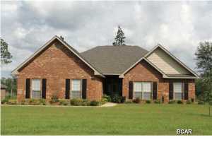 The Jamison is an awesome plan with spacious living areas. The family room has a two sided wood burning fireplace with arched openings on both sides that opens on to the Florida room. The kitchen has lots of designer cabinets, a large walk in pantry, stainless steel appliances, 3 cm granite, ceramic tile and a huge breakfast nook huge with two sets of double windows. Located off the family room and kitchen is a formal dining room with a trey ceiling. On the other side of the house you will find the bedrooms and laundry room - what a novel idea to have the laundry room near the bedrooms! The master suite is located on the back of the home with an on suite which includes: a garden tub, shower, walk in closet and water closet. The house comes with wood in the foyer, family and formal