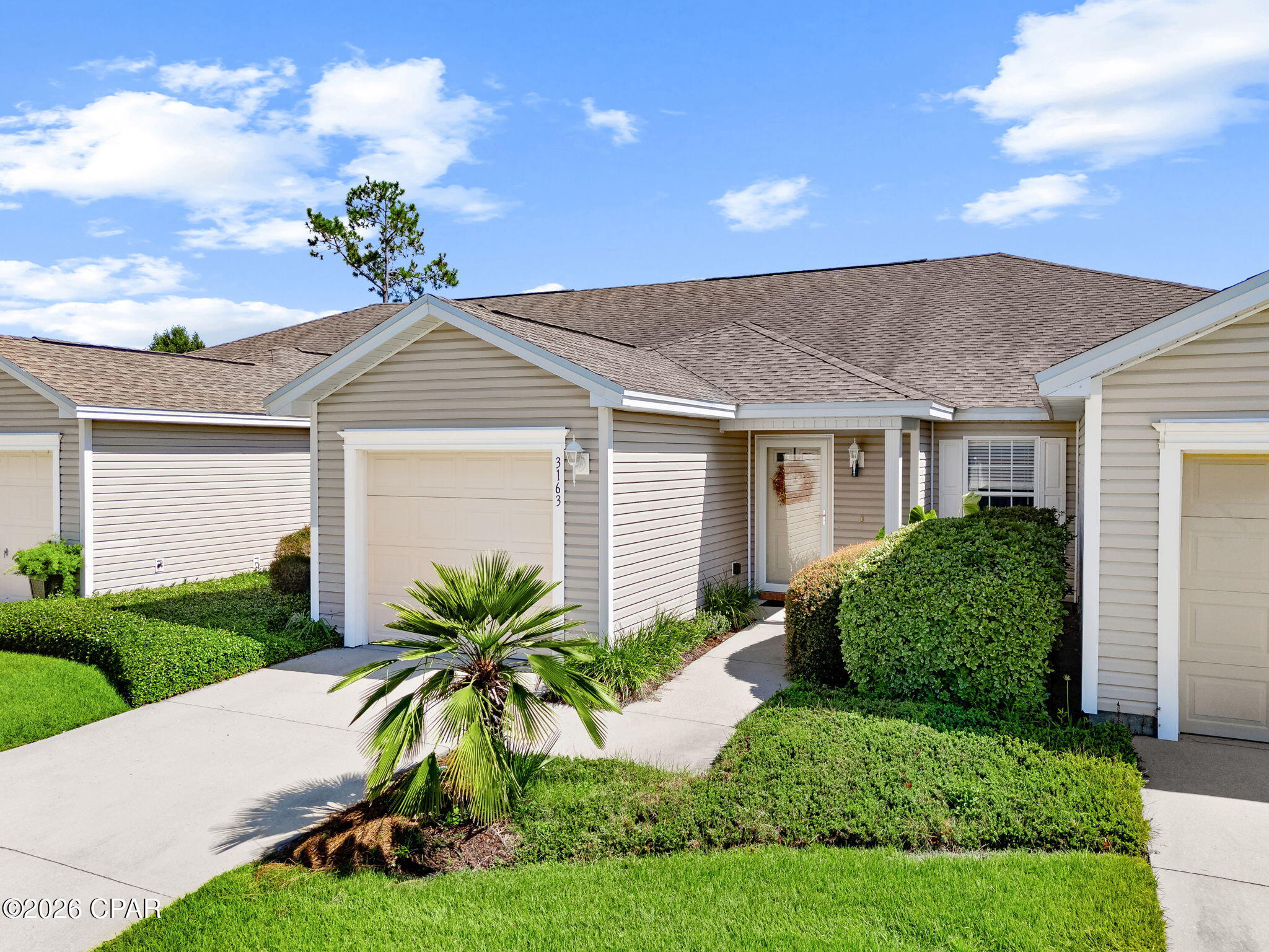 Welcome to 3163 Meadow Street, a well-maintained 2-bedroom, 2-bath townhome in The Hammocks, offering comfortable, low-maintenance living in a convenient Lynn Haven location. The open living area features a vaulted ceiling and flows into the dining area and fully equipped kitchen with breakfast bar, stainless steel sink, ceramic tile flooring, and sliding glass doors leading to the screened porch. 
The spacious master suite includes two walk-in closets and a private bath with double vanities. A second bedroom and full bath provide flexibility for guests, a home office, or additional living space. Ceiling fans, double-pane windows, and an attached one-car garage with automatic opener add everyday convenience. 
Enjoy the 10' x 13' screened porch, an ideal spot for morning coffee or relaxing at the end of the day. The Hammocks offers a community pool and gazebo, sidewalks, underground utilities, and professionally maintained landscaping. Association services also include lawn care. 
Located near schools, shopping, restaurants, grocery stores, the library, and other Lynn Haven conveniences, this townhome combines a practical floor plan with the benefits of easy-care community living. Whether you're looking for a primary residence, a comfortable place to downsize, or simply less exterior maintenance, 3163 Meadow Street is ready for its next owner.