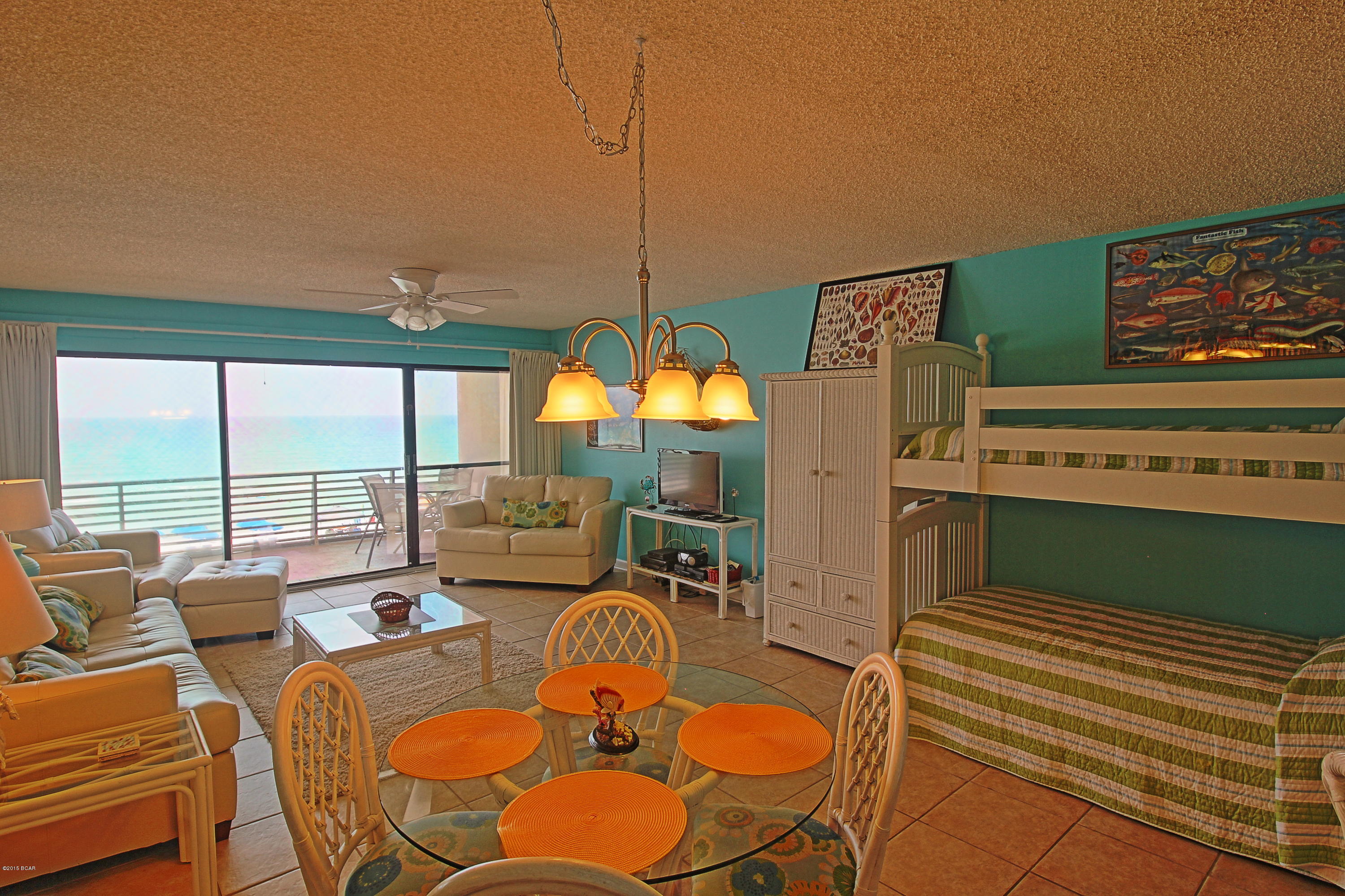 Seller will pay $1000 of buyers closing costs at closing! One of the largest Gulf front one bedroom floor plans in PCB. Gulfgate is located on 300' of Gulf front in a family oriented area of beach homes just off Thomas Drive. Low density 5 story complex of only 56 condos with excellent HOA management. Owners may have pets! Perfect location near some of the best restaurants, marinas, family recreation and the state park. 918 square feet of living space! The galley kitchen, breakfast bar, bunks, and the great room all overlook the Gulf. King bedroom and remodeled full bath. Stack W/D and owners closet in the hall. Newer oversized neutral tile in hall, great room, kitchen and bath. Large balcony with new ceiling fan and patio furniture. Partially covered, heated pool. Onsite rental management Call your Realtor...this one is vacant and easy to see today!