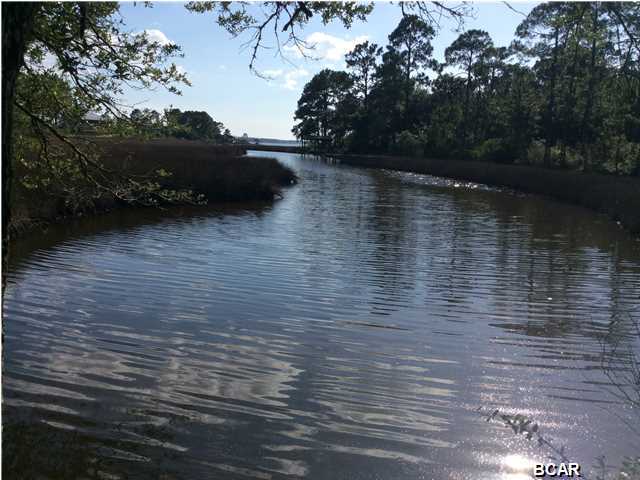 A sense of place...abundant waterway recreation where you can fish do some crabbing, boating, kayaking, paddle boarding, swimming... reconcile with nature, feel the calm, the real and beautiful... This private 220 foot wide waterfront, Gulf access, 1.81 acre lot is perfectly located and has a road access you can keep the trees you want and clear the rest for your new home. Electric city pole is available. You'll need a septic and a well. You'll catch Red-fish, trout, blue crab... right from the backyard of your new dream home. No mobile homes but Manufactured home is ok. Come live your adventure... 19 minutes from the main shopping street, groceries, restaurants, doctors... A very nice neighborhood, where people like you are in harmony with the outdoors....come close to what's real,