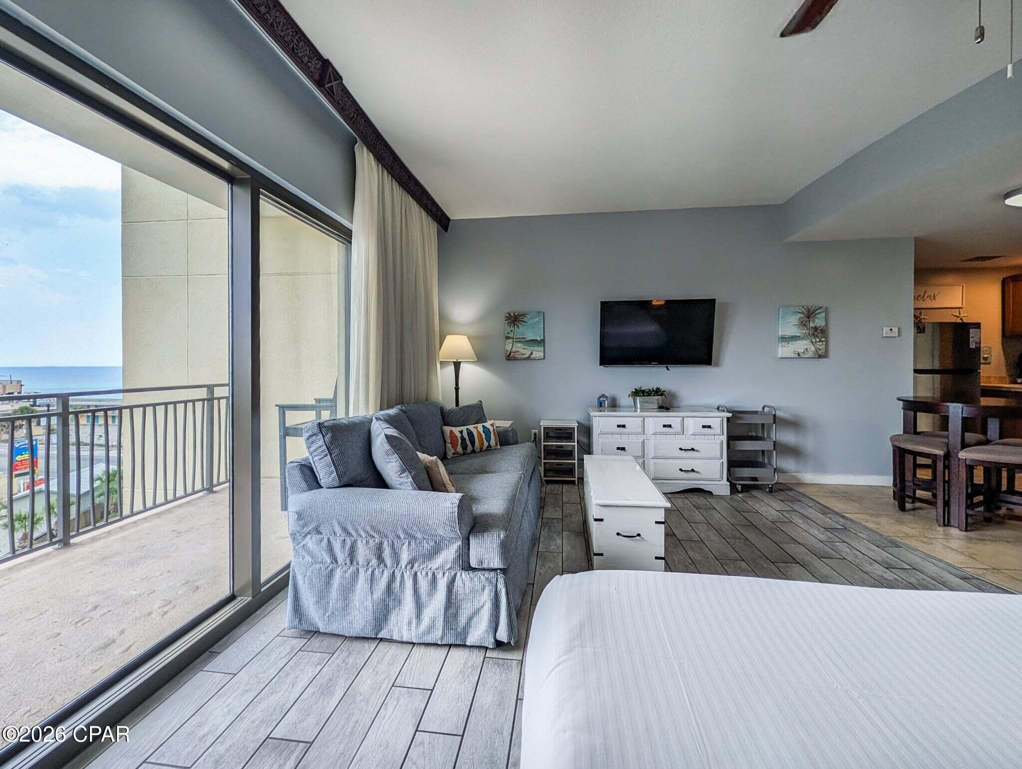 Opportunity is knocking in this beautifully renovated and fully furnished studio unit at Origin!  Unit 529 is not the ''typical'' studio on the beach.  The floor plan is designed in a way that the sleeping area feels tucked away into a space of its own, while keeping the kitchen and living areas open and inviting.  In the kitchenette, you have all you need for a quick meal in with the microwave and 2-burner stove, and the addition of the full size fridge adds enough space for leftovers and all your drinks!  The bath features a remodeled tub/shower combo, and full tiled vanity wall.  The entire condo has tile floors throughout, with a modern gray wood-look tile in the living and sleeping areas.  The queen sized sleeper sofa in the living area and the king sized bed allow for up to 4 guests at a time.  Through the large sliding glass window is an oversized balcony with great Gulf views where you can see the sand and surf.  Unit 529, simply put, is an adorable condo that continues to welcome its guests to a comfy and relaxing stay on the sugar sands of PCB!  Origin is one of the very few high-rise condos in PCB to offer interior corridors, keeping you safe and dry during inclement weather.  There is a deeded beach access just across Front Beach Road, and within walking distance to a multitude of beachfront bars, restaurants, entertainment, Pier Park, and Top Golf.  Origin offers many amenities including two BBQ grill/picnic areas, a heated pool, hot tub, theater, game room, laundry facility, vending, a gated community with 24 hour security, and retail on site including Beaches and Cream convenient store and grill, and Sunsations beach store.  Make this one your next investment, or even you personal piece of paradise!  Call me anytime to schedule your showing before its too late!